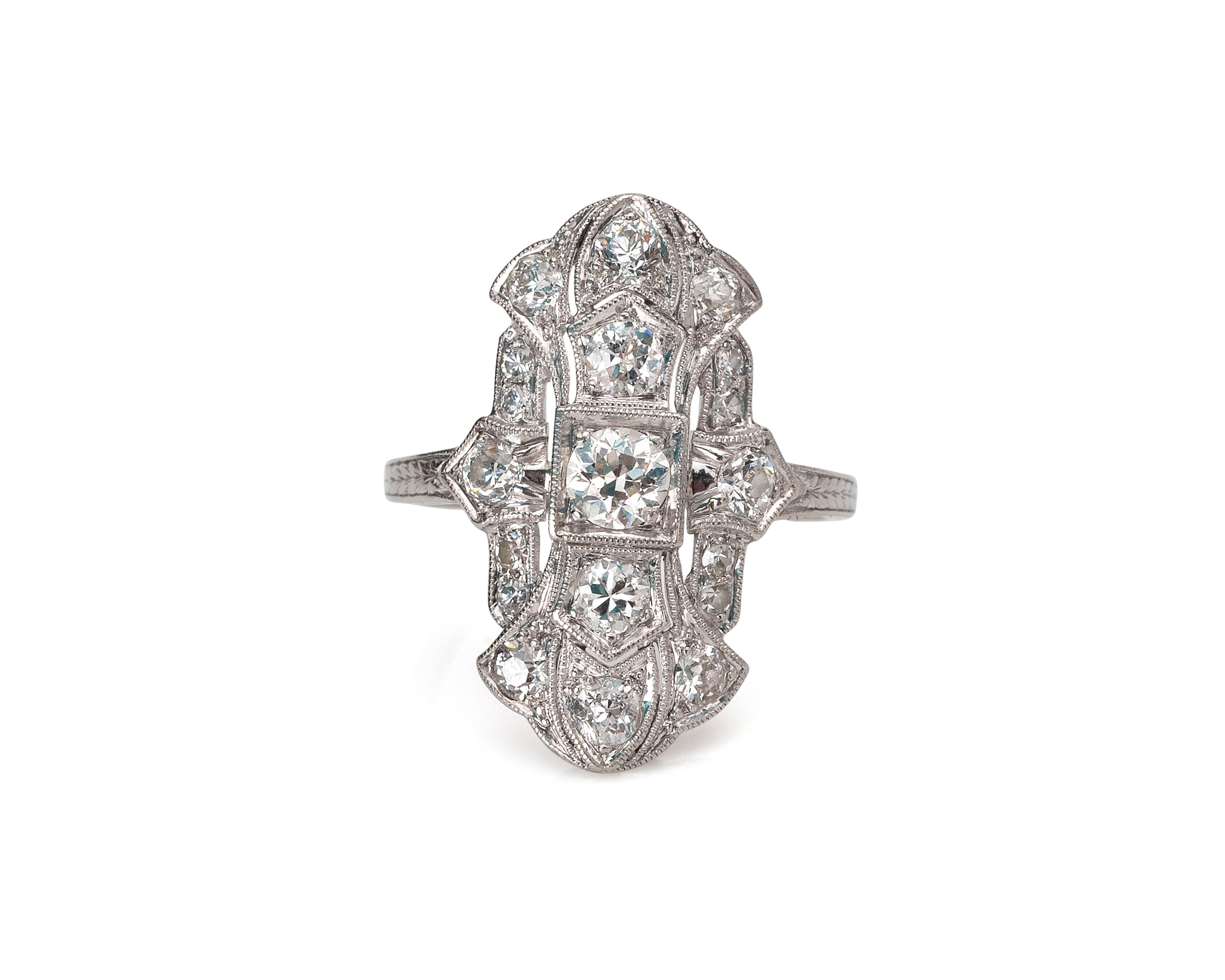 Here we have an excellent example of a 1920's era platinum ring in a classic Art Nouveau style. This stunning shield is crafted in platinum with a total of 1.07 carats of dazzling old cut diamonds adorning the stylish curvaceous ring. This ring is