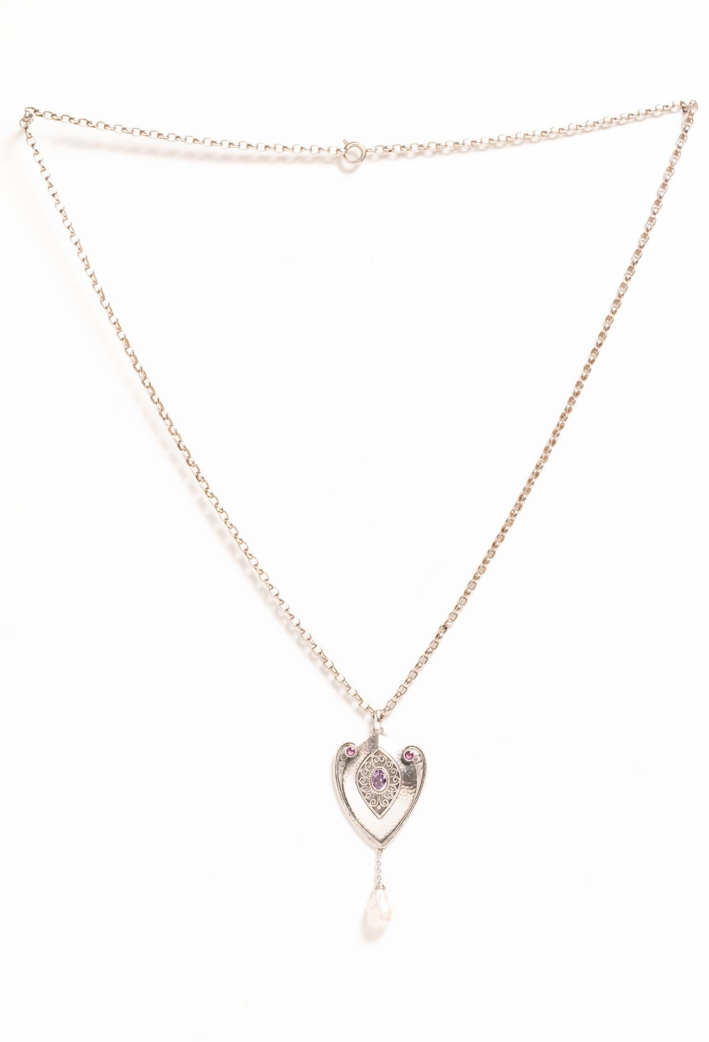 A very rare 19th century antique Art Nouveau silver amethyst and pearl pendant necklace dated circa 1890, probably made in Austria or Germany. This exquisitely hand-crafted in intricate silver pendant necklace features an openwork design to the