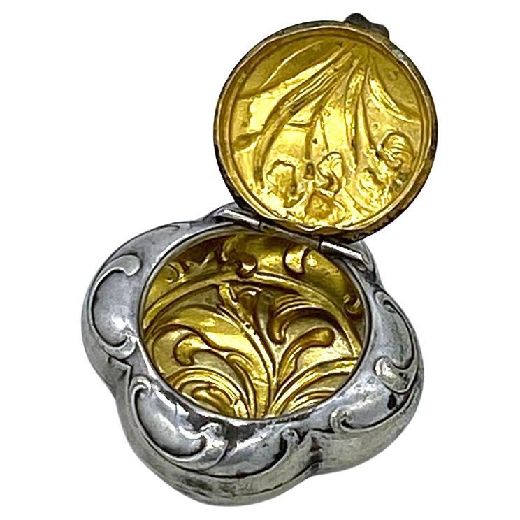 This is an antique Art Nouveau style silver chatelaine box. It comes from Austria with gilt inside silver box with iris motif on the lid. I have included a 19.25 inch sterling silver chain necklace for your convenience to wear as a pendant