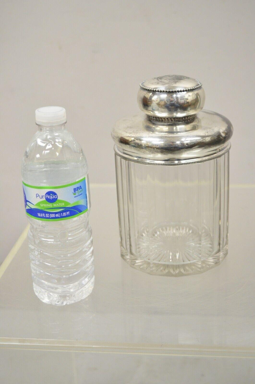 Antique Art Nouveau silver plated lid cotton swab lidded crystal vanity jar. Item features silver plated lid, cut glass crystal jar, monogram to top of lid, unmarked. 19th century. Measurements: 8