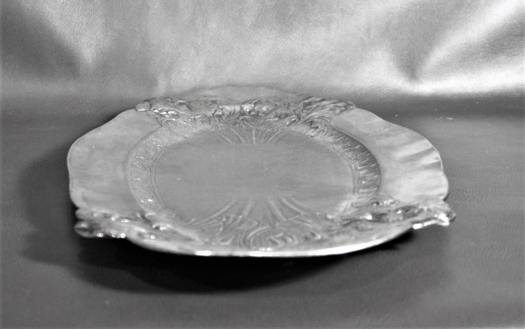 20th Century Antique Art Nouveau Silver Plated Oval Serving Tray with Raised Floral Motif For Sale