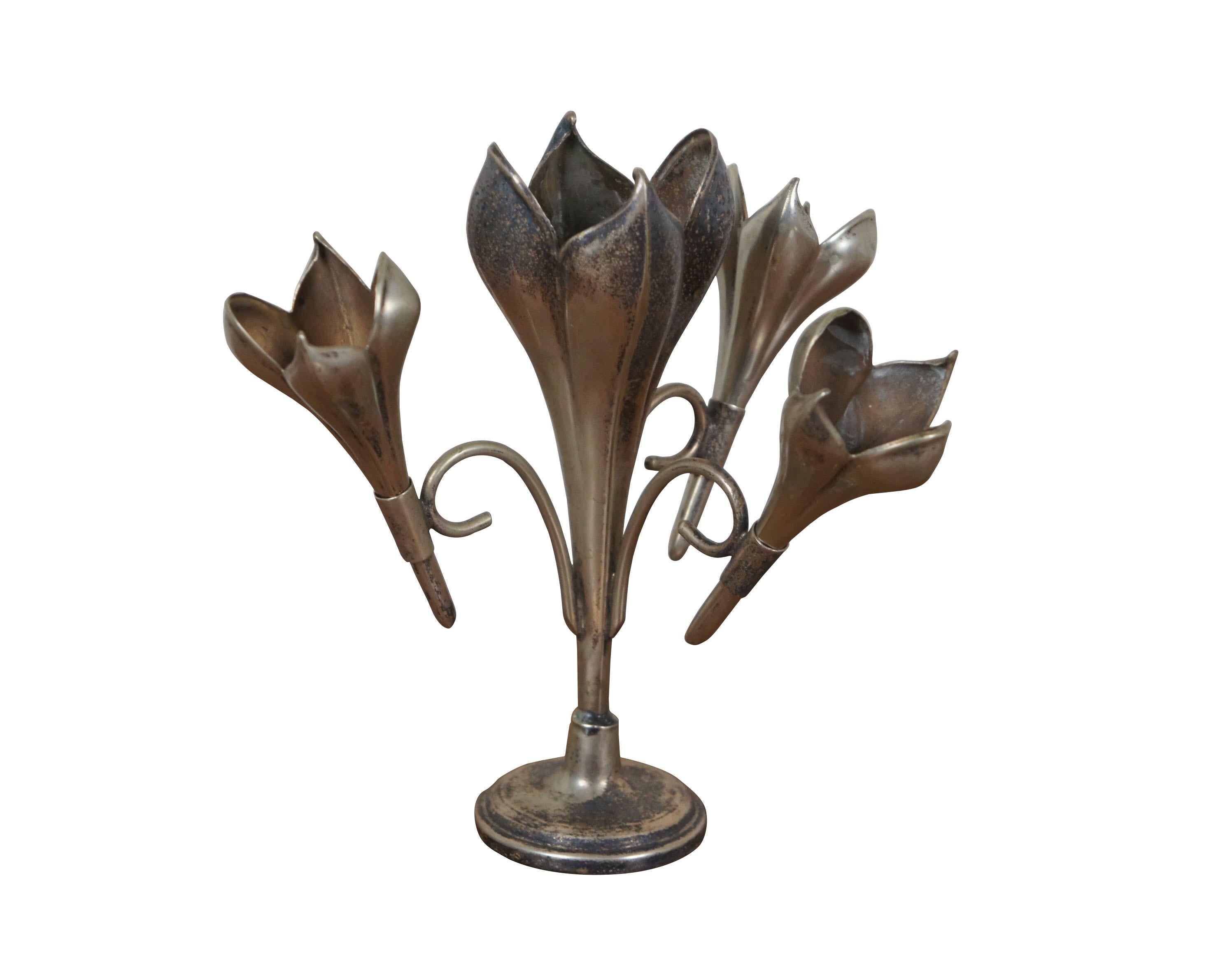 Early 20th century art nouveau silver plated epergne / bud vase. Round pedestal base supporting central crocus blossom / trumpet shaped vase and three smaller trumpets / blossoms in scrolled supports. Base marked 9711-4 R.

Dimensions:
8