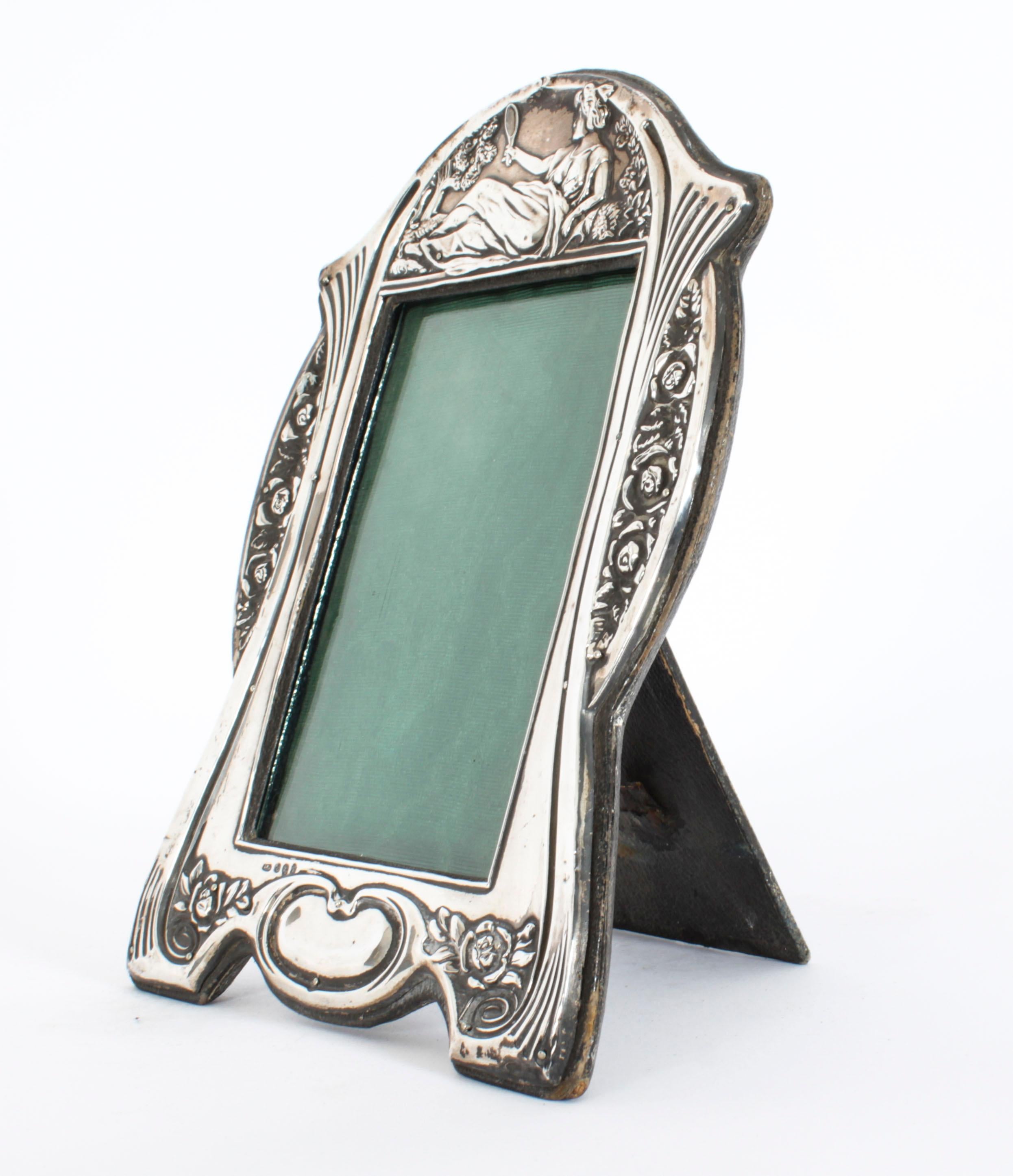 A stunning Edwardian silver photograph frame of Art Nouveau design having a leather easel back. 
 
With hallmarks for Birmingham 1907 and the makers mark of Samuel M Levi; 
 
Beautifully portrait frame decorated with relief floral, foliate and