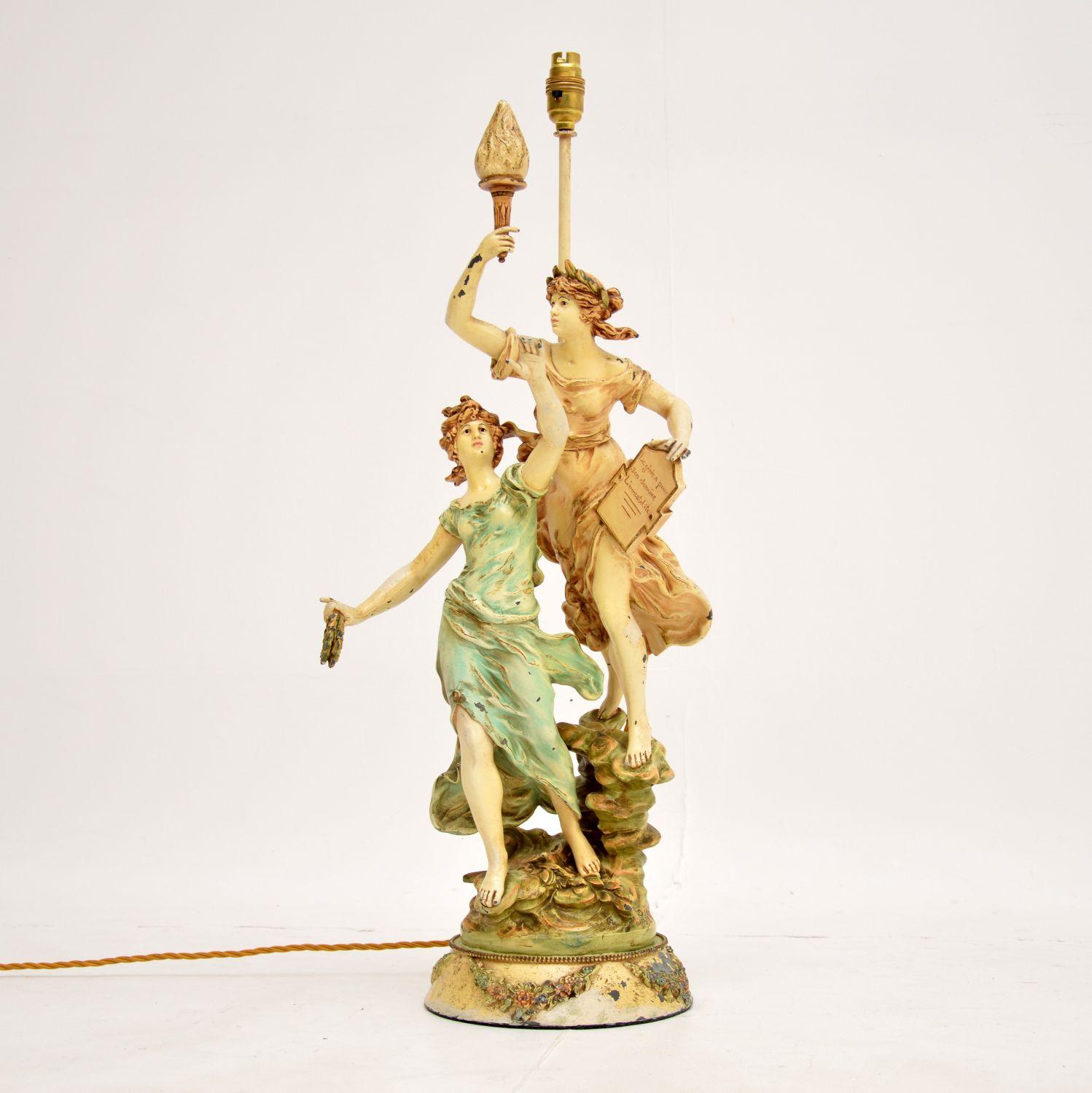 A stunning antique Art Nouveau period table lamp in painted cast spelter. This design is by L & F Moreau, it dates from around the 1900-1920’s.

The quality is superb, this is beautifully designed and is a very impressive sculpture.

The condition
