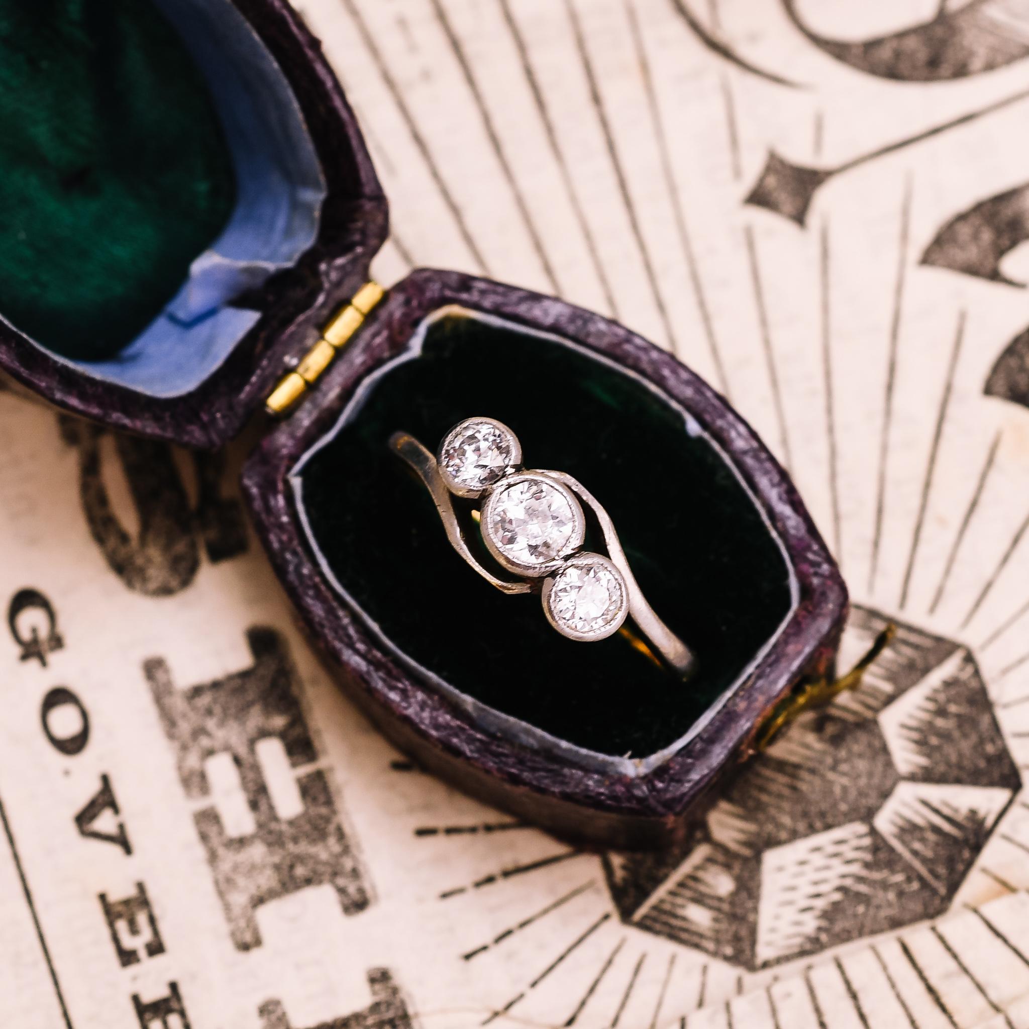 Round Cut Antique Art Nouveau Three-Stone Diamond Crossover Ring