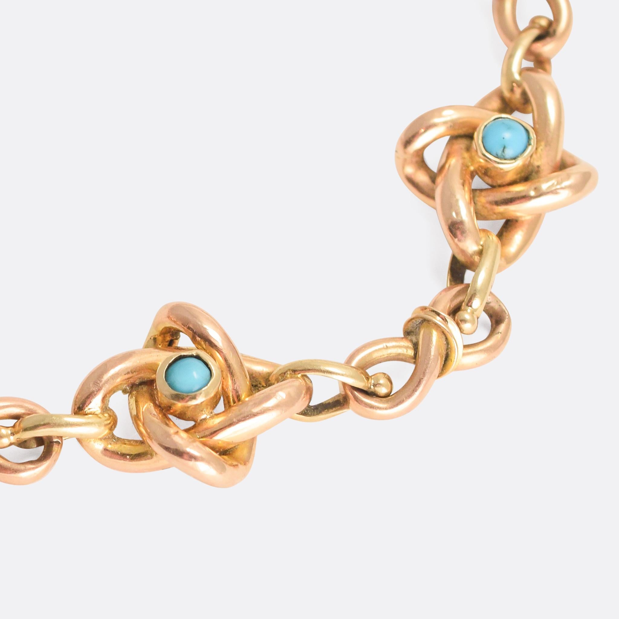This elegant antique bracelet is modelled in 15k gold and set with Persian turquoise cabochons. The links are stylishly worked: alternating infinity loops, and gem set gold knot motifs - it dates from the turn of the 20th Century, circa 1900,