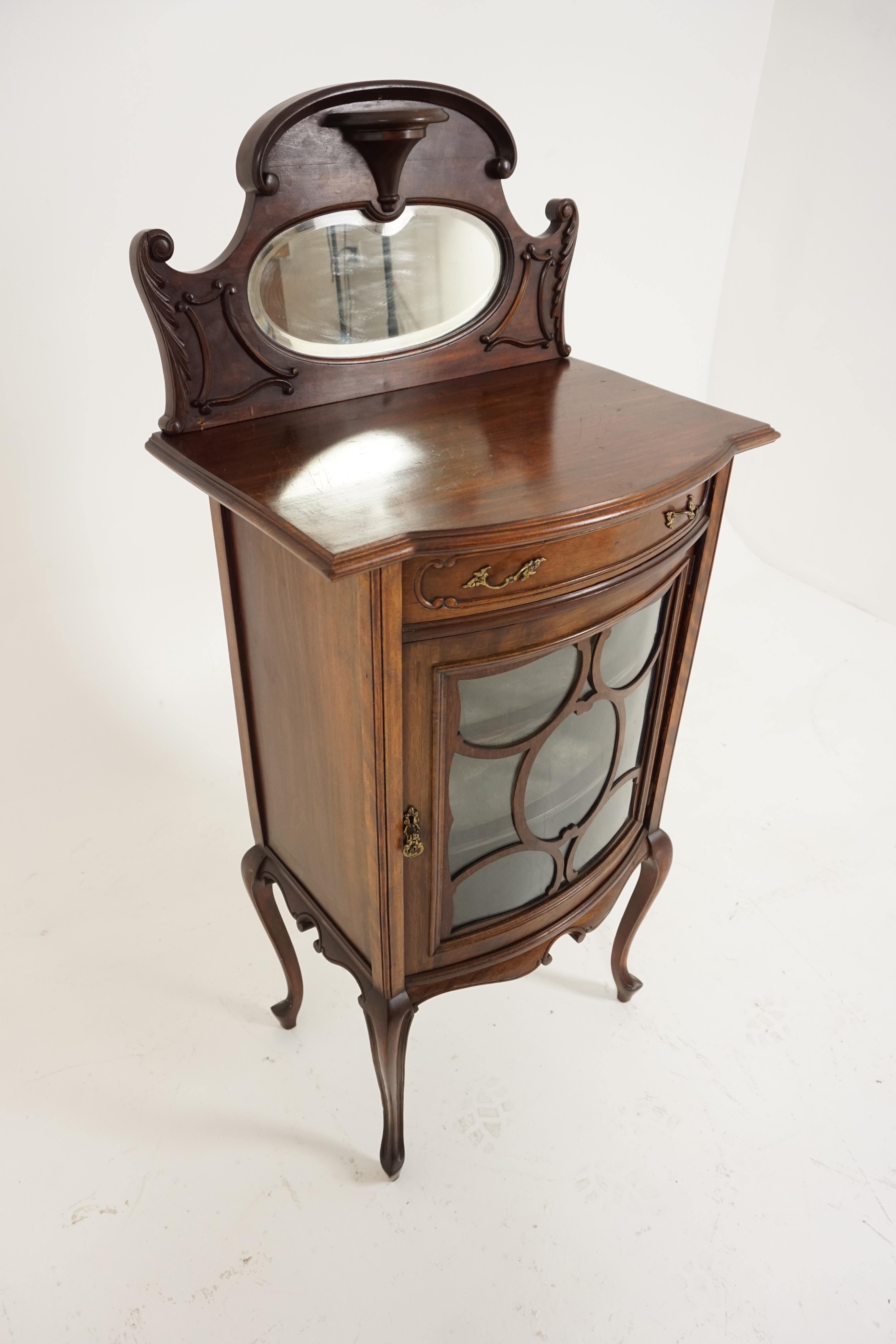 Antique Art Nouveau walnut sheet music cabinet, Scotland 1900, B1801

Scotland 1900
Solid walnut
Original finish
Carved back with oval beveled mirror above
Serpentine top
Below is a single bow front drawer with Art Nouveau brass pulls
Below