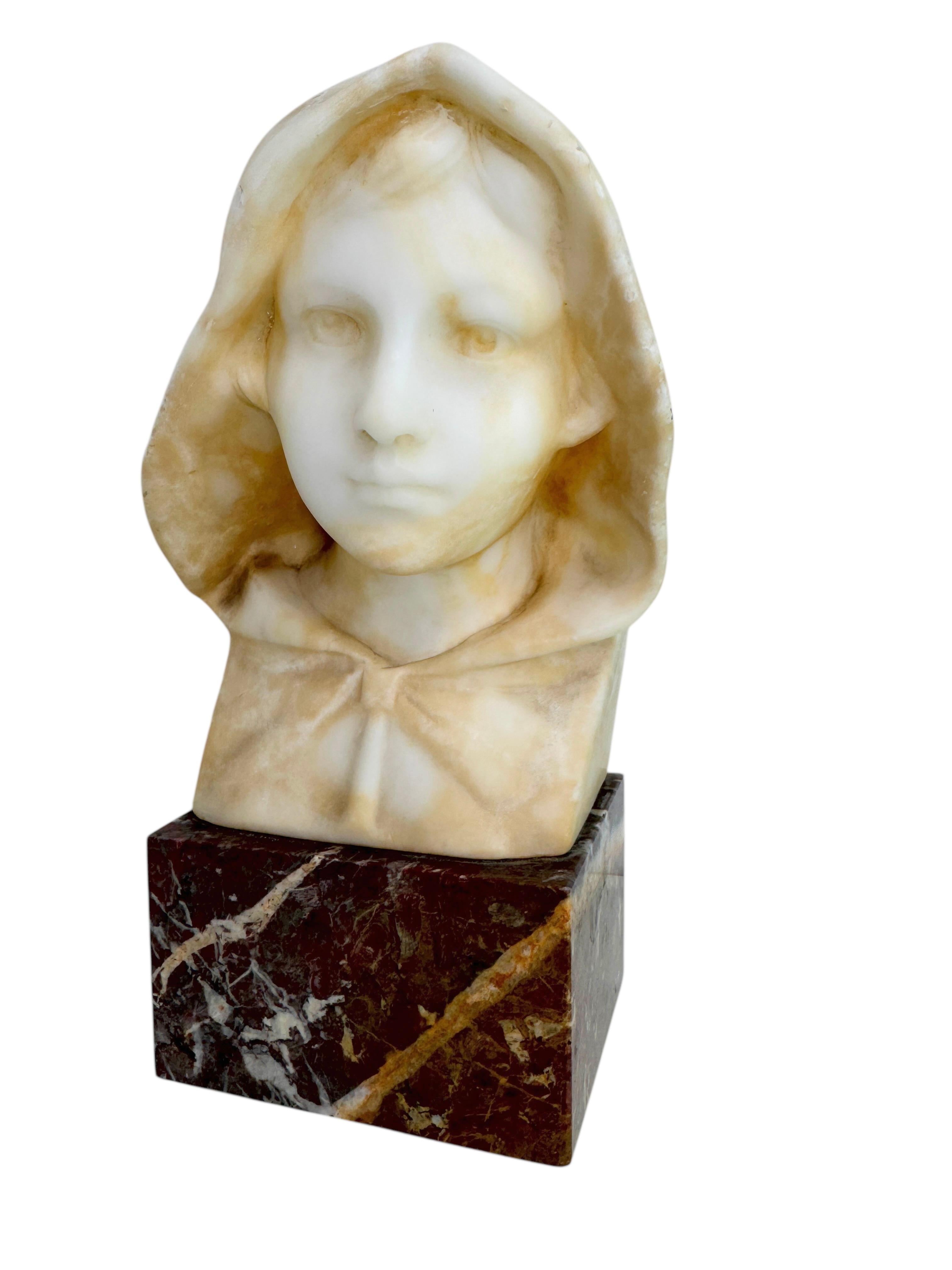 A classic decorative Bust statue. Some wear with a nice patina, but this is old-age. Made of white alabaster on a marble base. Very decorative and nice to display in your library or any room. Signed backside Trapassi. Found at an Estate sale in