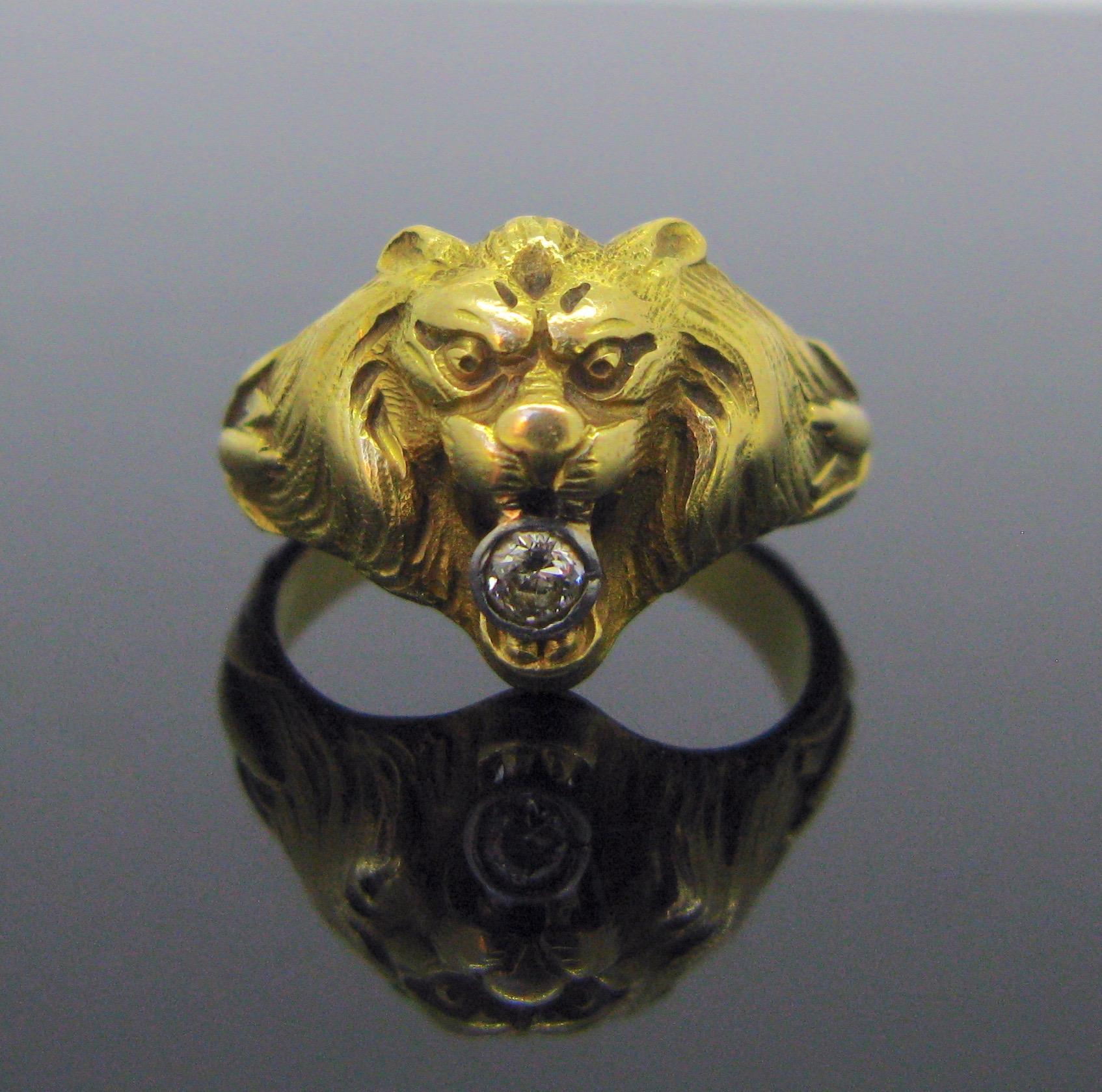 This ring was nicely designed into a Lion head. It has a strong design. It depicts a regal lion with flowing mane in exceptional detail. It holds in his jaws an old mine cut diamond weighing around 0.20ct. The ring is very good antique condition. It