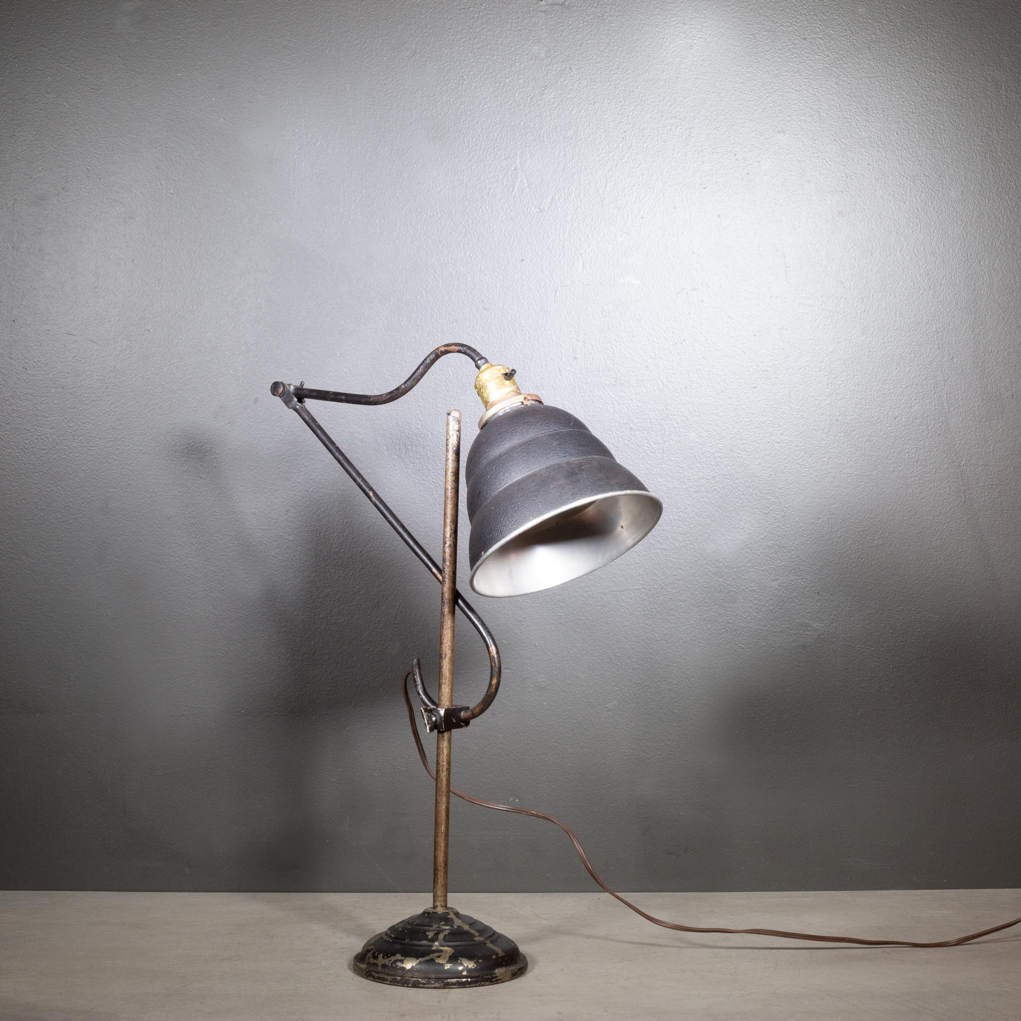 ABOUT

An original fully adjustable industrial task lamp with black, metal shade. Height is adjustable by sliding the lamp up and down through the connecting clamp and at the joint. 

    CREATOR L. Bianchini, San Francisco, Ca. 
    DATE OF