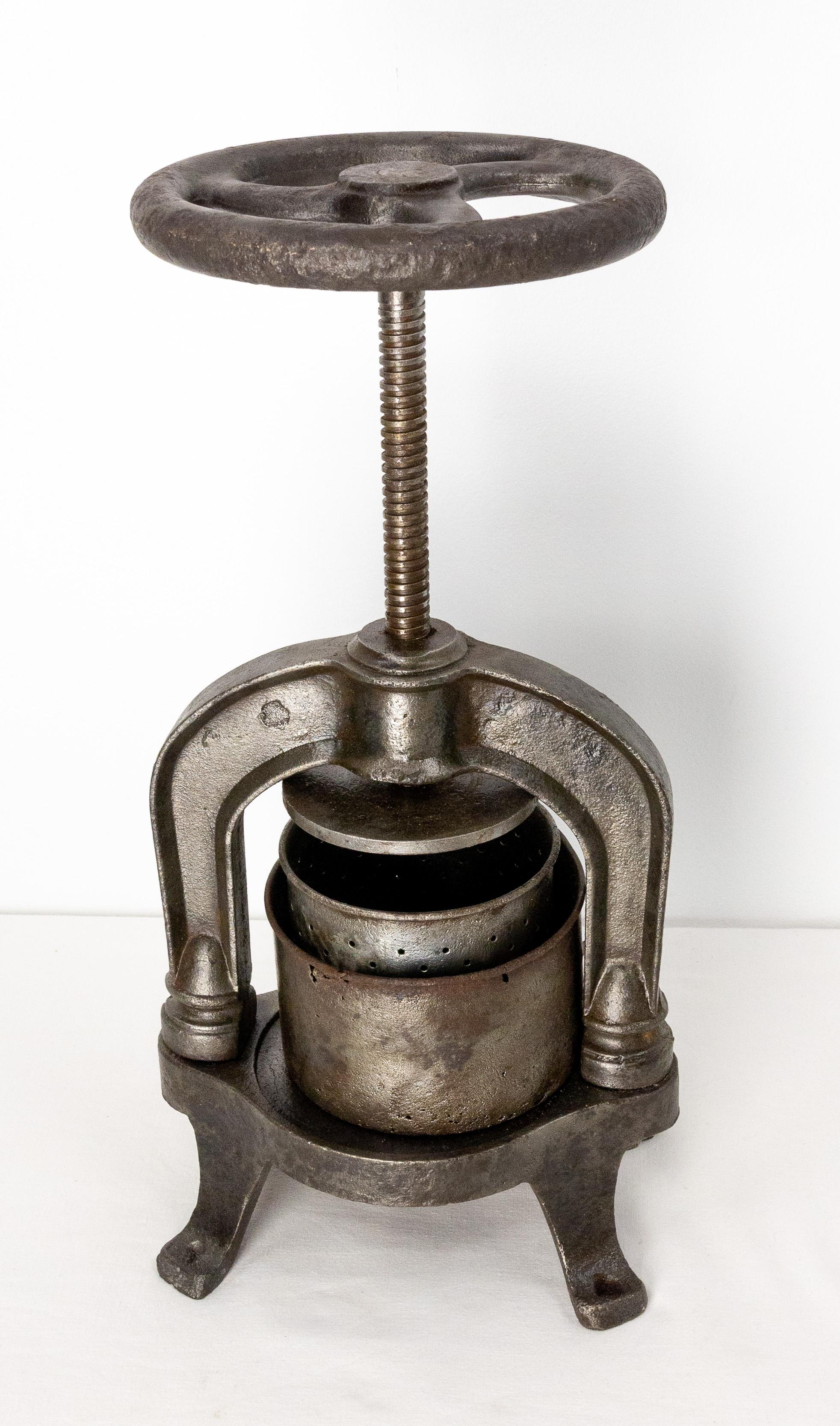 This cast iron fruit press was made in the late 19th century in France.
It was probably used by the little fruit producers to make olive oil or fruit juice. 
Patina and signs of use which make this antique object very characterful.
Good condition
