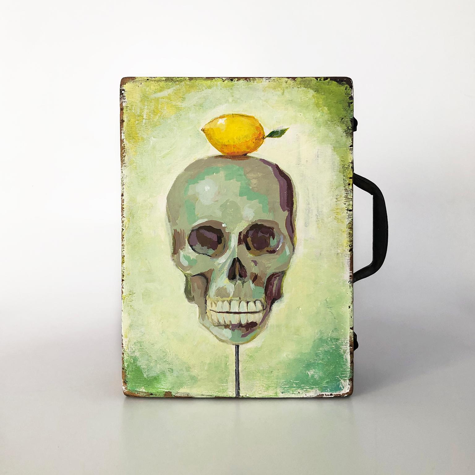 We offer this rare antique artist box with skull with lemon painting, circa 1940.