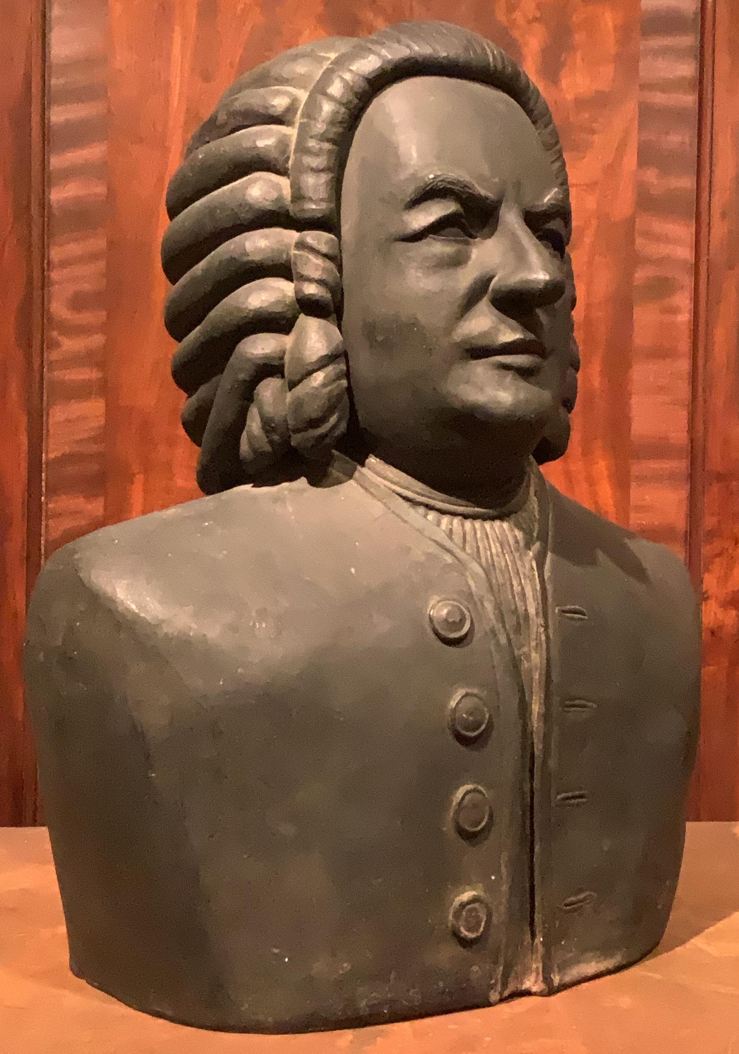 A wonderful and charming 1940's artist-made terracotta bust of composer Johann Sebastian Bach. very handsome form with expressive features and nice scale. in its original matte black painted finish.