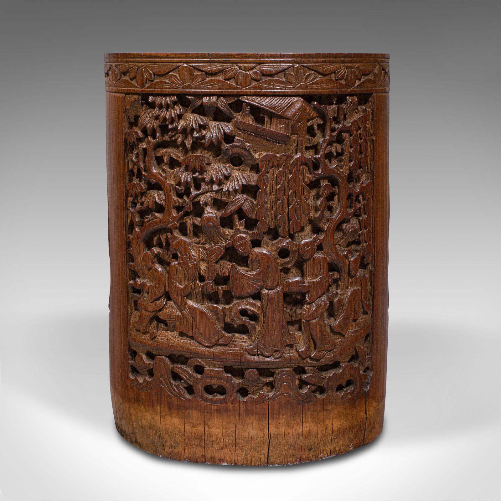 This is an antique artist's brush pot. A Chinese, carved bamboo treen, dating to the late Victorian period, circa 1900.

Enthusiastically carved detail within a broad bamboo trunk
Displaying a desirable aged patina and in good order
Bamboo shows