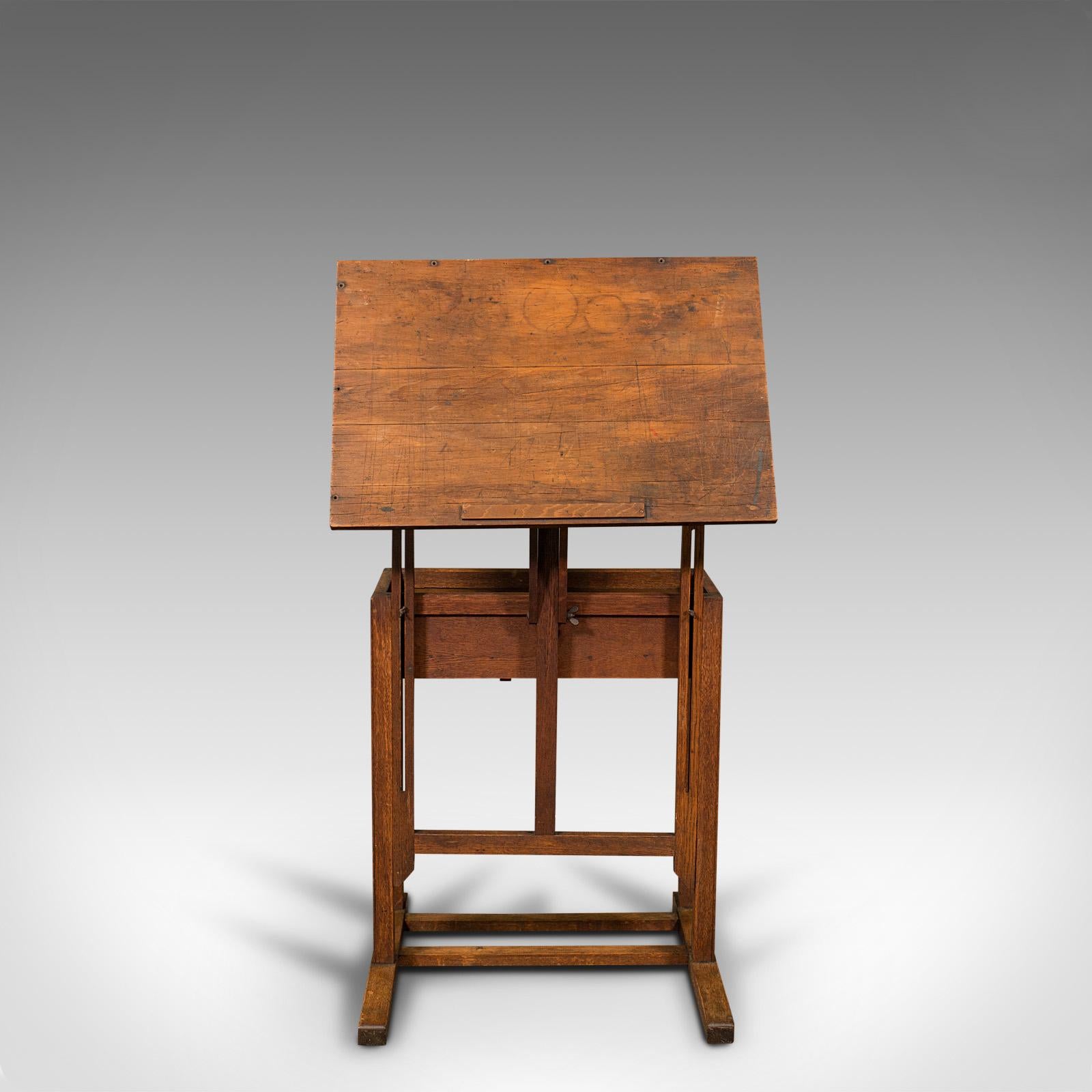 This is an antique artist's easel. An English, oak adjustable draughtsman's rest or lectern, dating to the Edwardian period, circa 1910.

Fascinating Edwardian easel for the artist or orator.
Displaying a desirable aged patina and in good