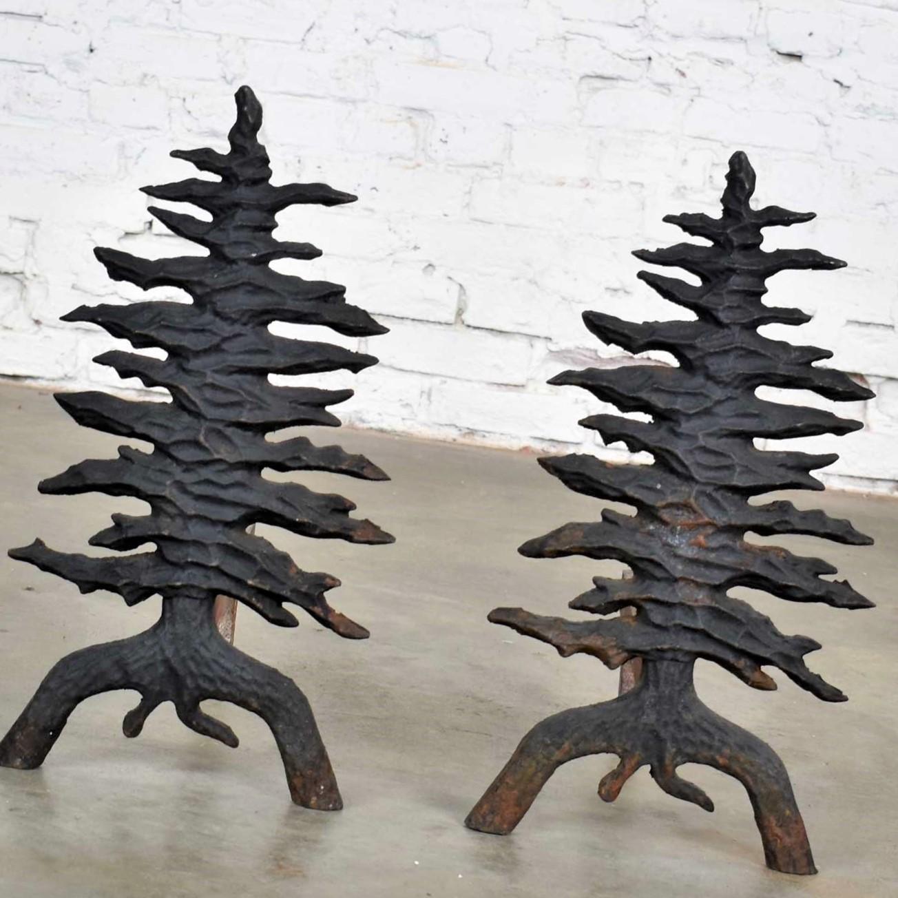 Handsome pair of antiques Arts & Crafts cast iron andirons in the form of a pine tree. Made by Martin Industries and marked Martin Pat Appld For. They are in awesome antique condition with a lovely patina. Please see photos, circa early 20th