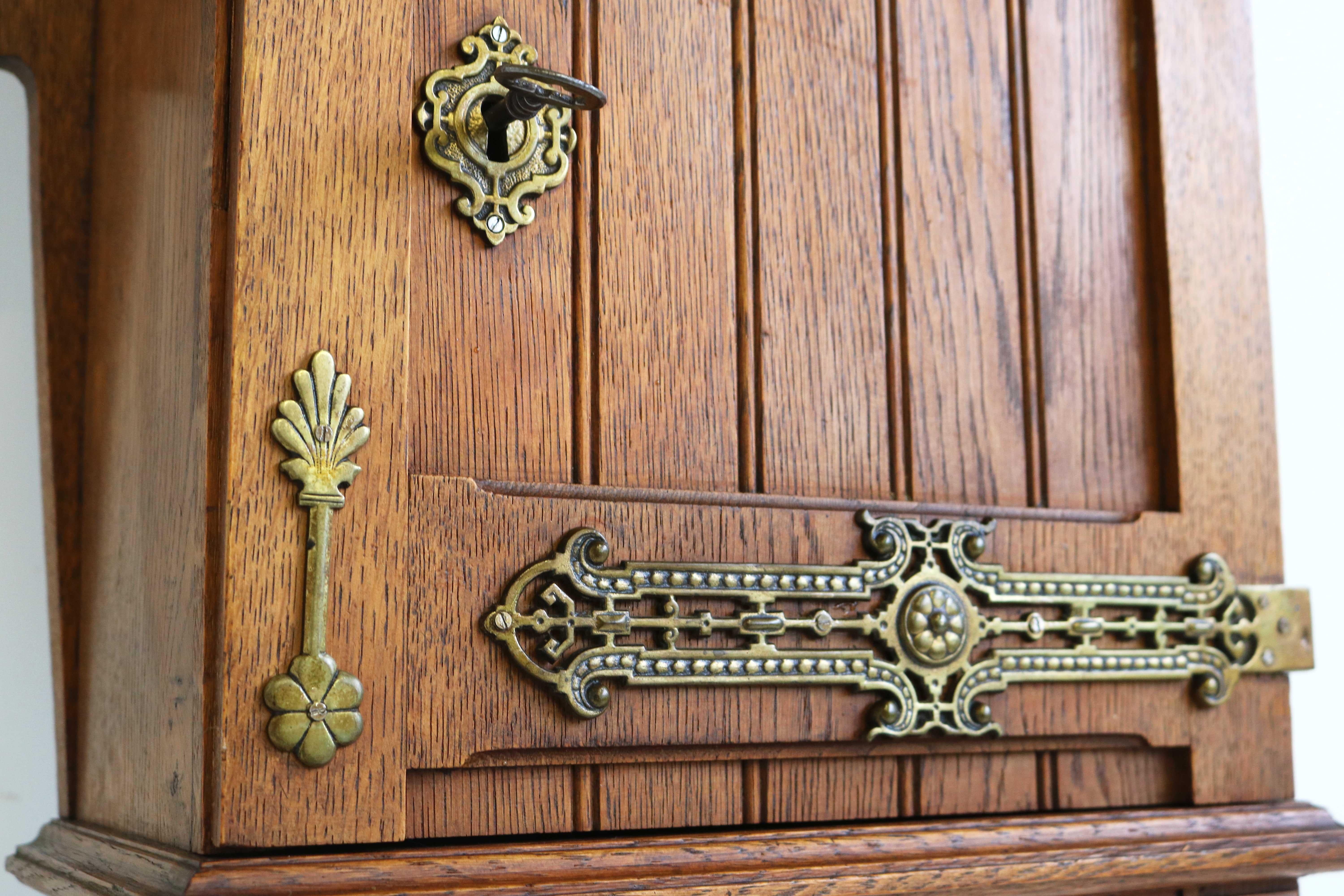 Hand-Crafted Antique Arts and Crafts Hand Carved Small Wall Cabinet European Oak Brass, 1900s For Sale