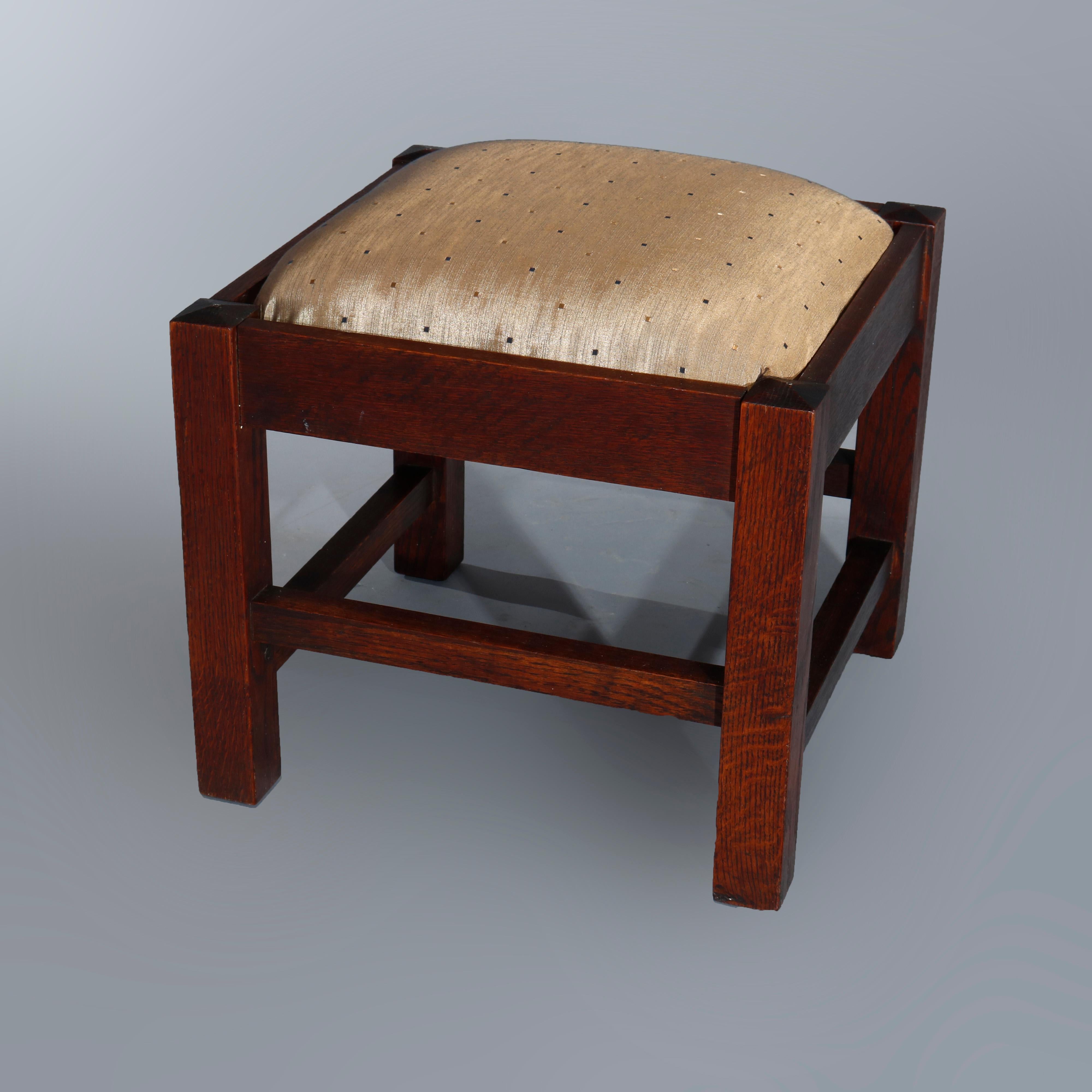 An antique and large Arts & Crafts Mission ottoman in the manner of Stickley Bros. offers upholstered seat within oak frame having square and straight legs, circa 1910.

Measures: 20