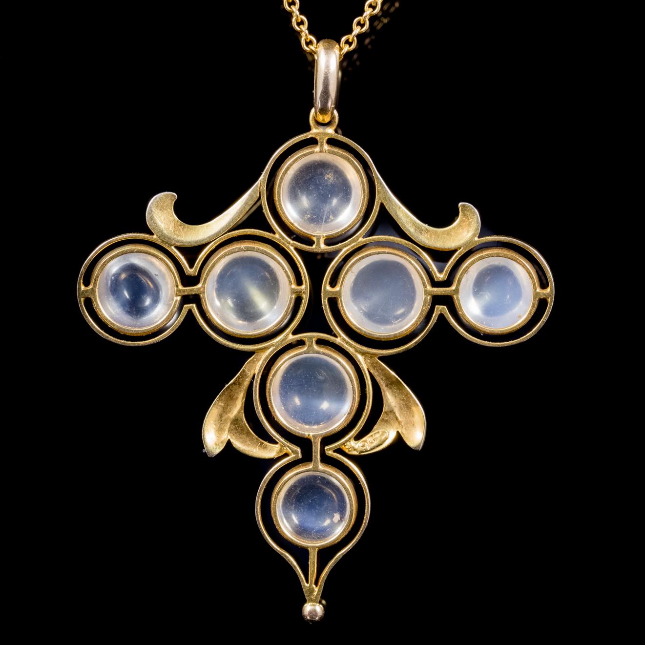 A fabulous antique Arts and crafts necklace C. 1900, featuring a cross pendant crowned with seven cabochon Moonstones which are approx. 1.50ct each. 

The Arts and Crafts movement breathed new life into the design of jewellery in the late 19th