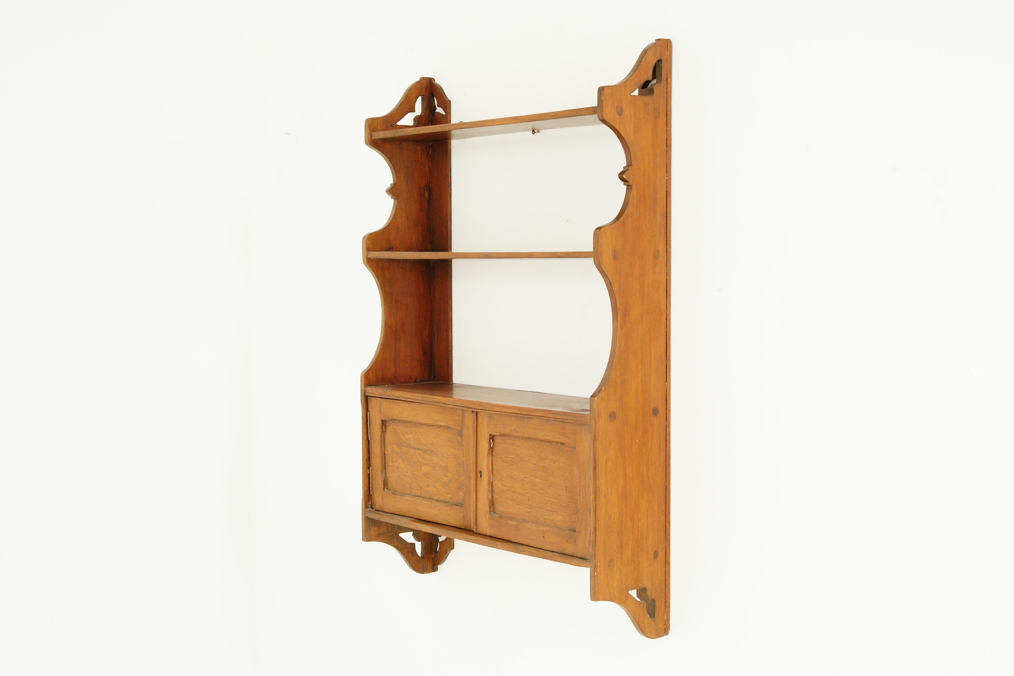 Antique Arts & Crafts oak 3-tiered wall cabinet, Antique Furniture, Scotland 1910

Scotland 1910
Solid oak, original finish
Shaped top to the sides
Three shelves below
Pair of panelled doors underneath
Open to reveal single shelf
Nice colour