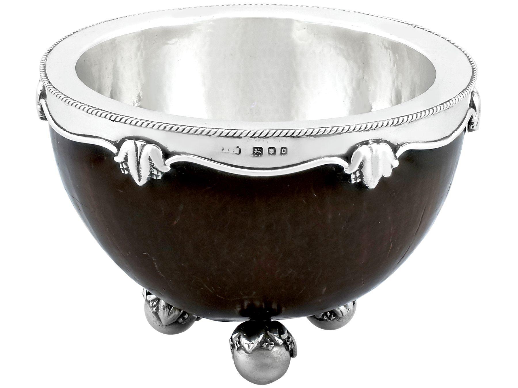 An exceptional, fine and impressive antique George V English sterling silver mounted coconut bowl in the Arts and Crafts style, made by Henry George Murphy; an addition to our diverse ornamental silverware collection.

This exceptional antique