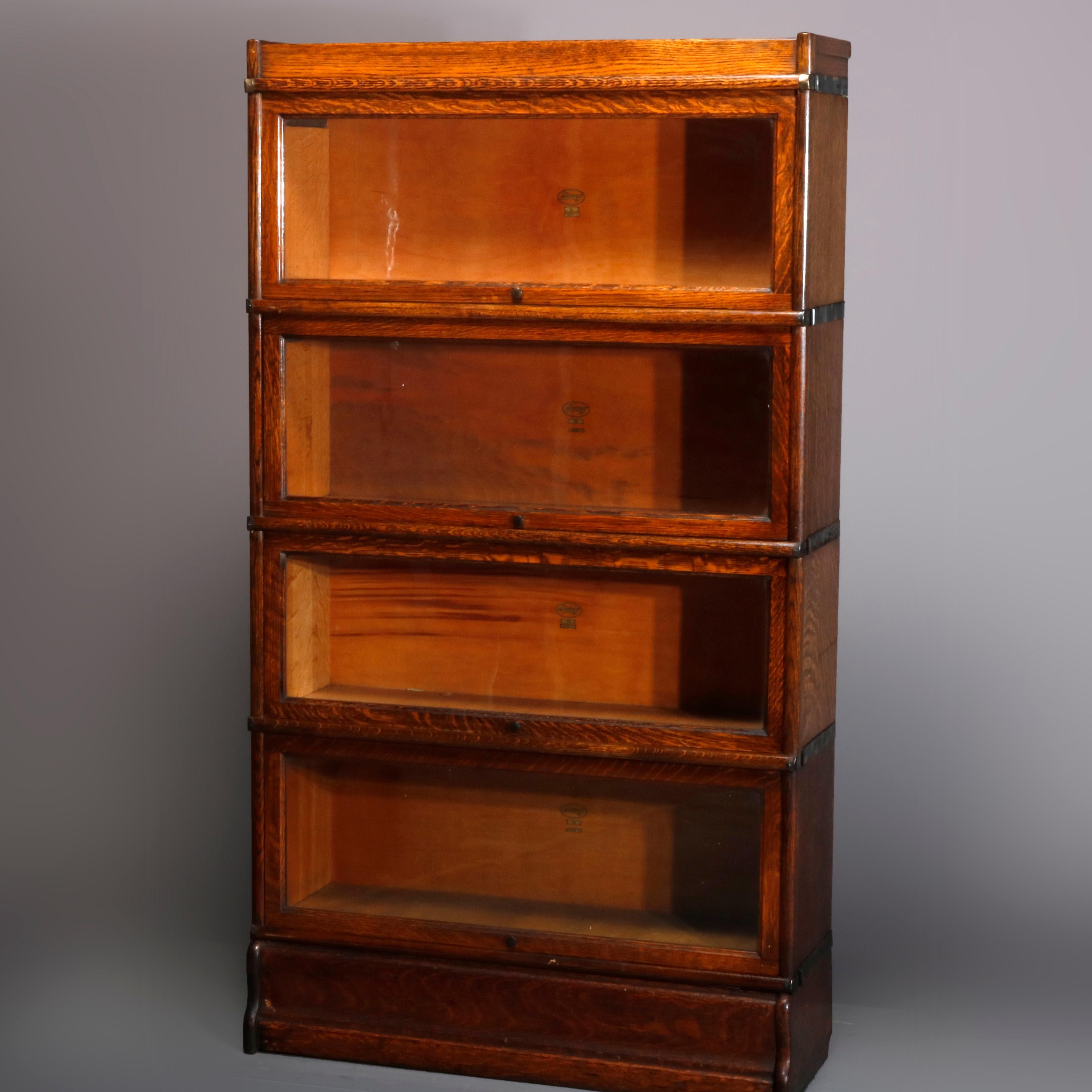 An antique Arts & Crafts Mission oak Barrister bookcase by Macey offers quarter sawn oak construction with four case stacks over base with lower drawer, original maker labels as photographed, circa 1910.

Measures- 61.5