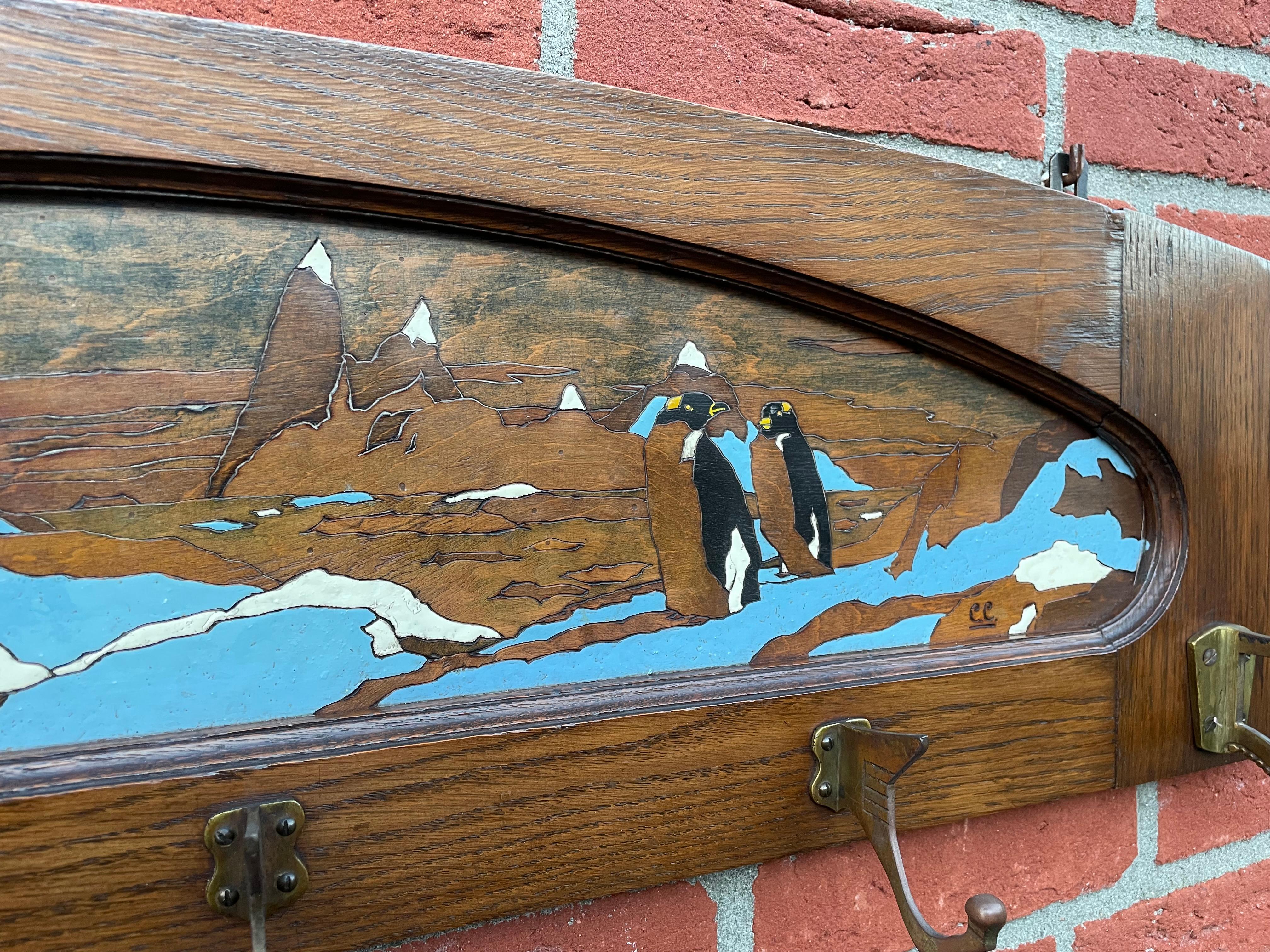 European Antique Arts & Crafts Wall Coat Rack With A Hand Carved & Painted Penguin Colony For Sale