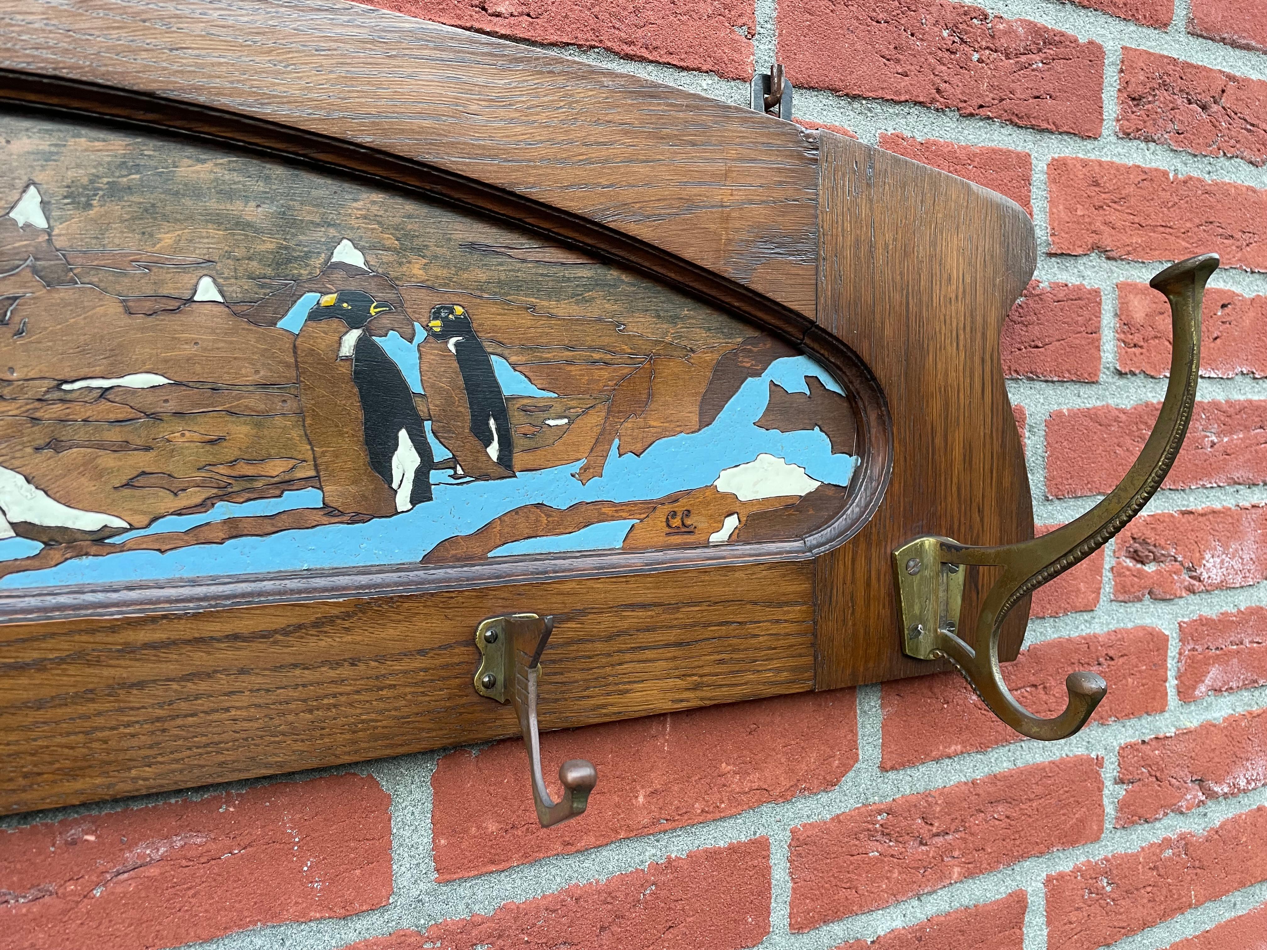 Antique Arts & Crafts Wall Coat Rack With A Hand Carved & Painted Penguin Colony In Good Condition For Sale In Lisse, NL