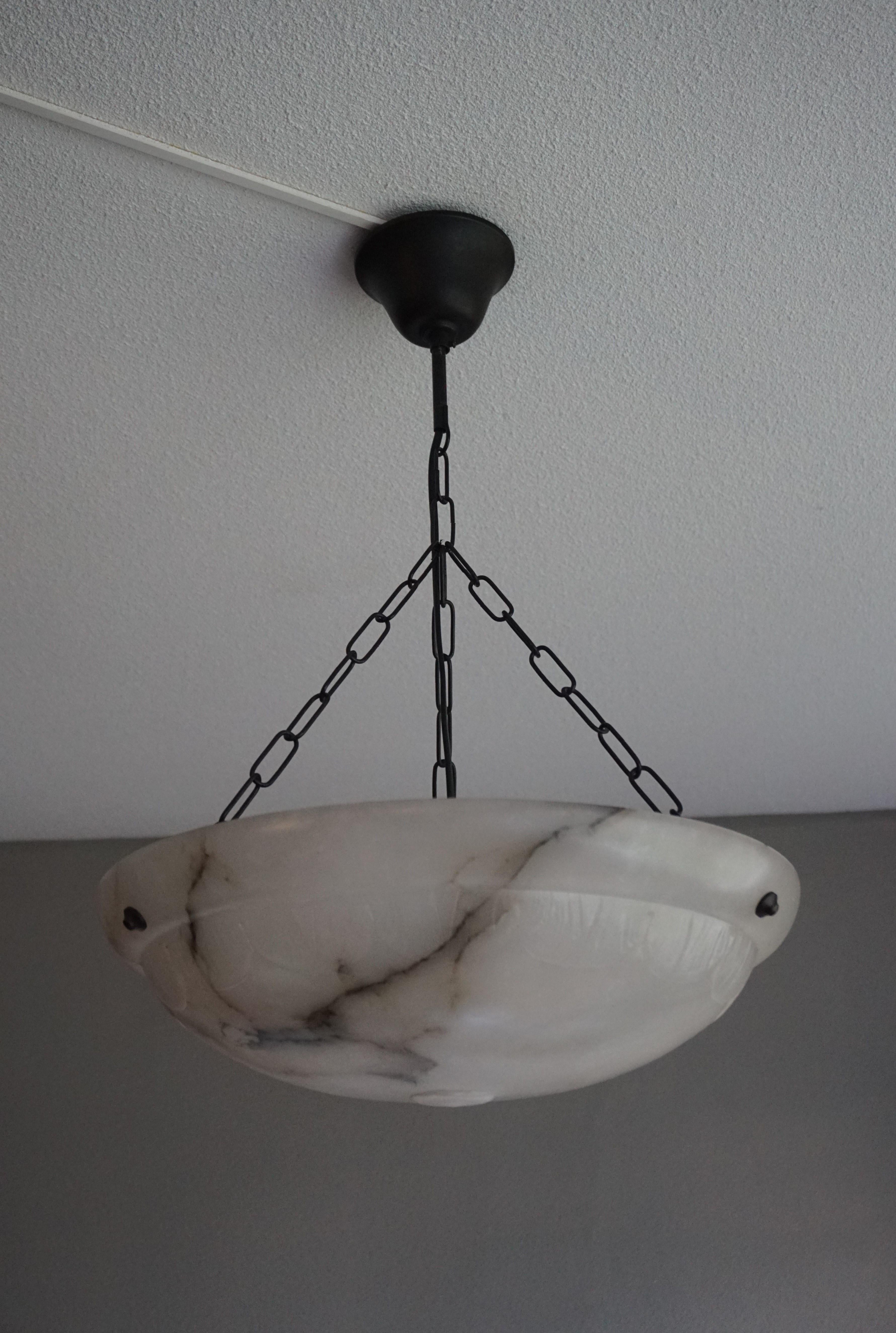 Beautiful design and excellent condition, early 1900s mineral stone pendant.

If you are looking for a good size and great looking Arts & Crafts era light fixture then this fine specimen with its unique pattern of black veins could be perfect for