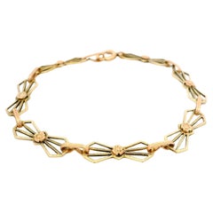 Antique Arts & Crafts 10k Green and Rose Gold Bow Geometric Open Work Bracelet