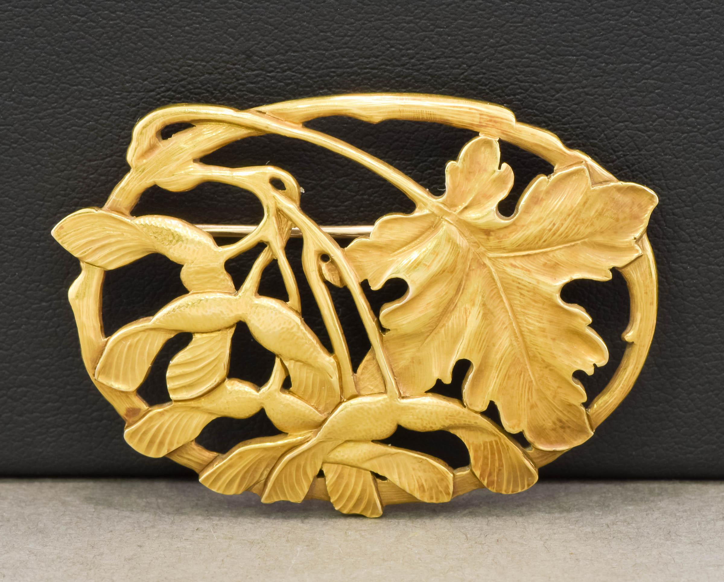 I'm delighted to offer a very special and hard to find Arts & Crafts period gold brooch by the esteemed Potter Studio (Horace Potter).  Beautifully made of 18K yellow gold (with a 14K pin stem), the large brooch features a maple leaf with samaras