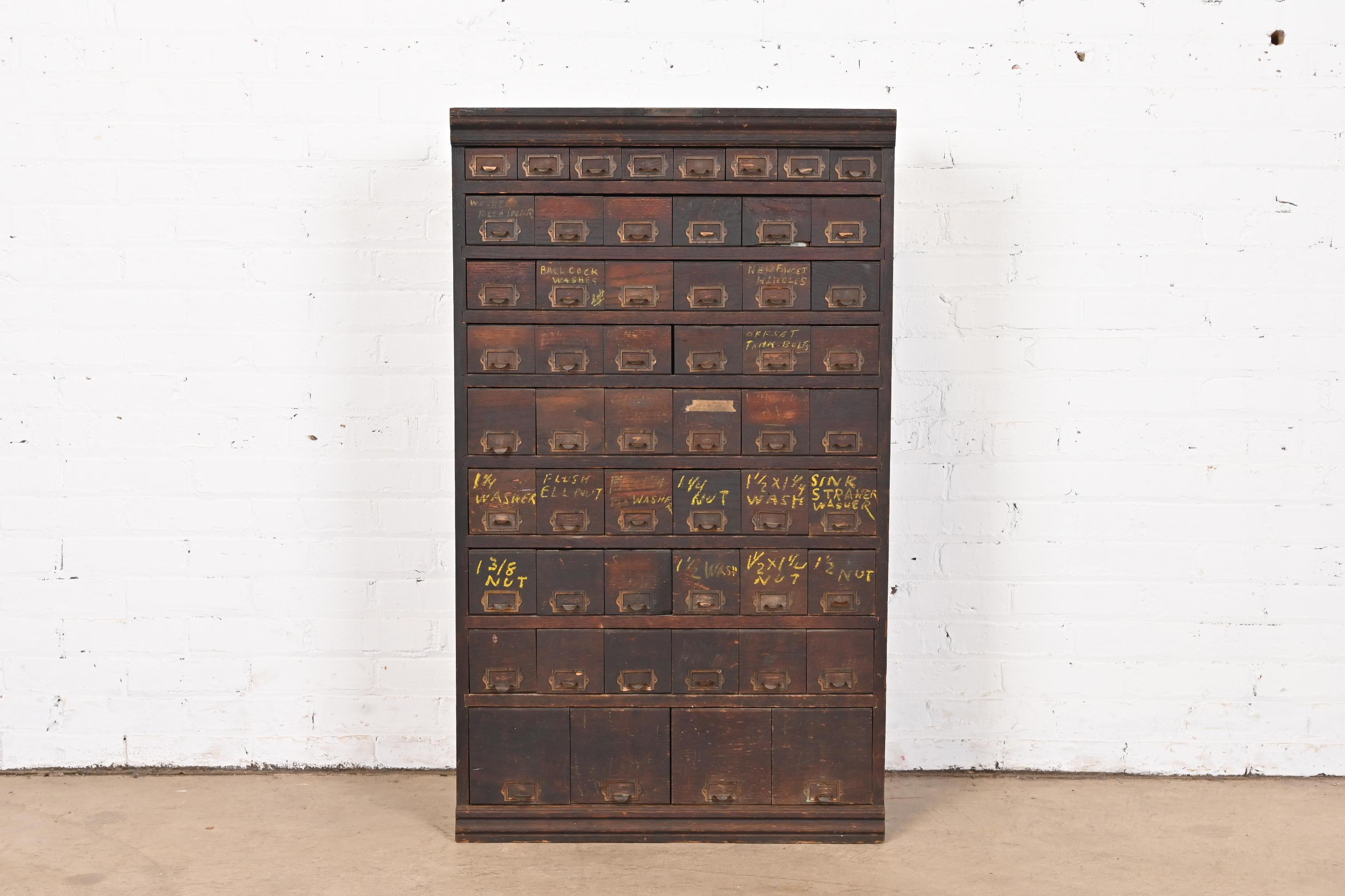 A rare antique Arts & Crafts card file cabinet or industrial parts cabinet

By W.C. Heller and Co.

USA, Circa 1900

Solid oak, with brass hardware and metal drawer interiors.

Measures: 25.5
