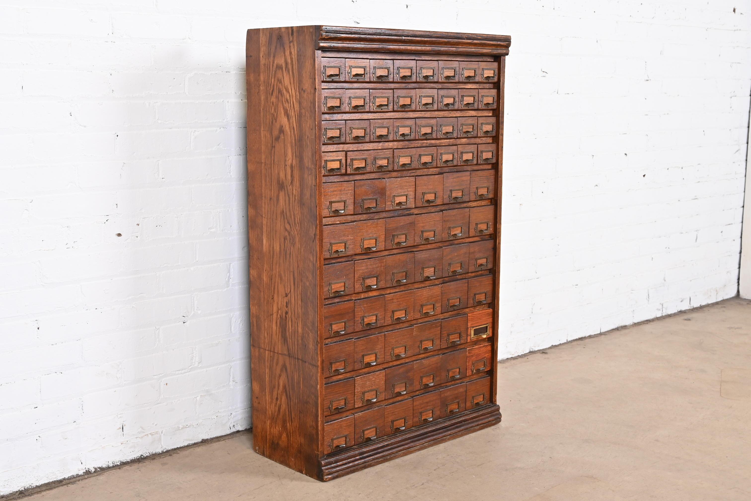 A rare antique Arts & Crafts card file cabinet or industrial parts cabinet

USA, circa 1900

Solid oak, with brass hardware and metal drawer interiors.

Measures: 25.5