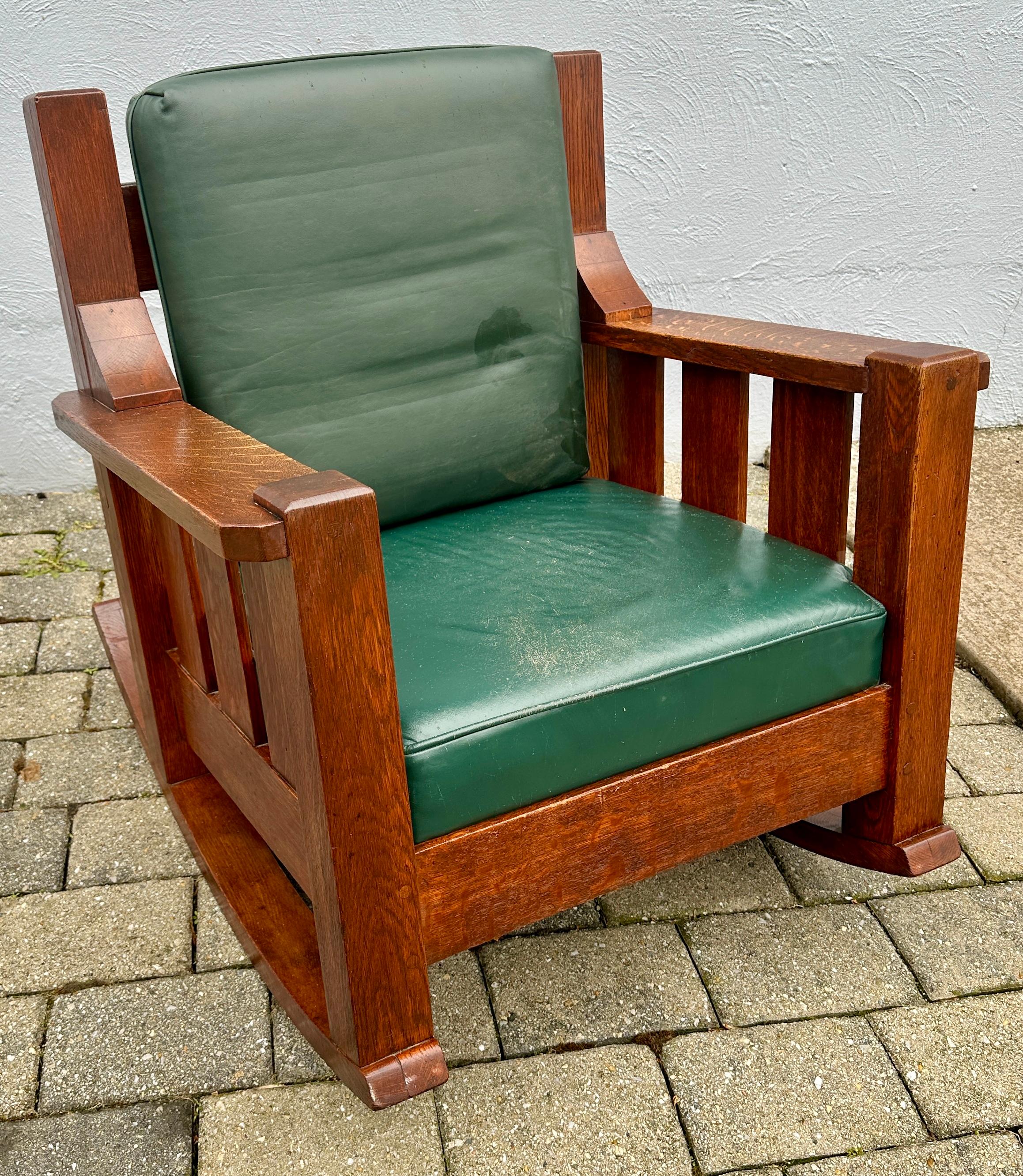 This is a great looking, bulky Lounge/Arm/Rocking Chair (Cube Chair).  It has a  KNOUSE  maker's mark from the early 1900s. The chair is in great condition with the original finish.  It still has older upholstery with some wear evident. If you are