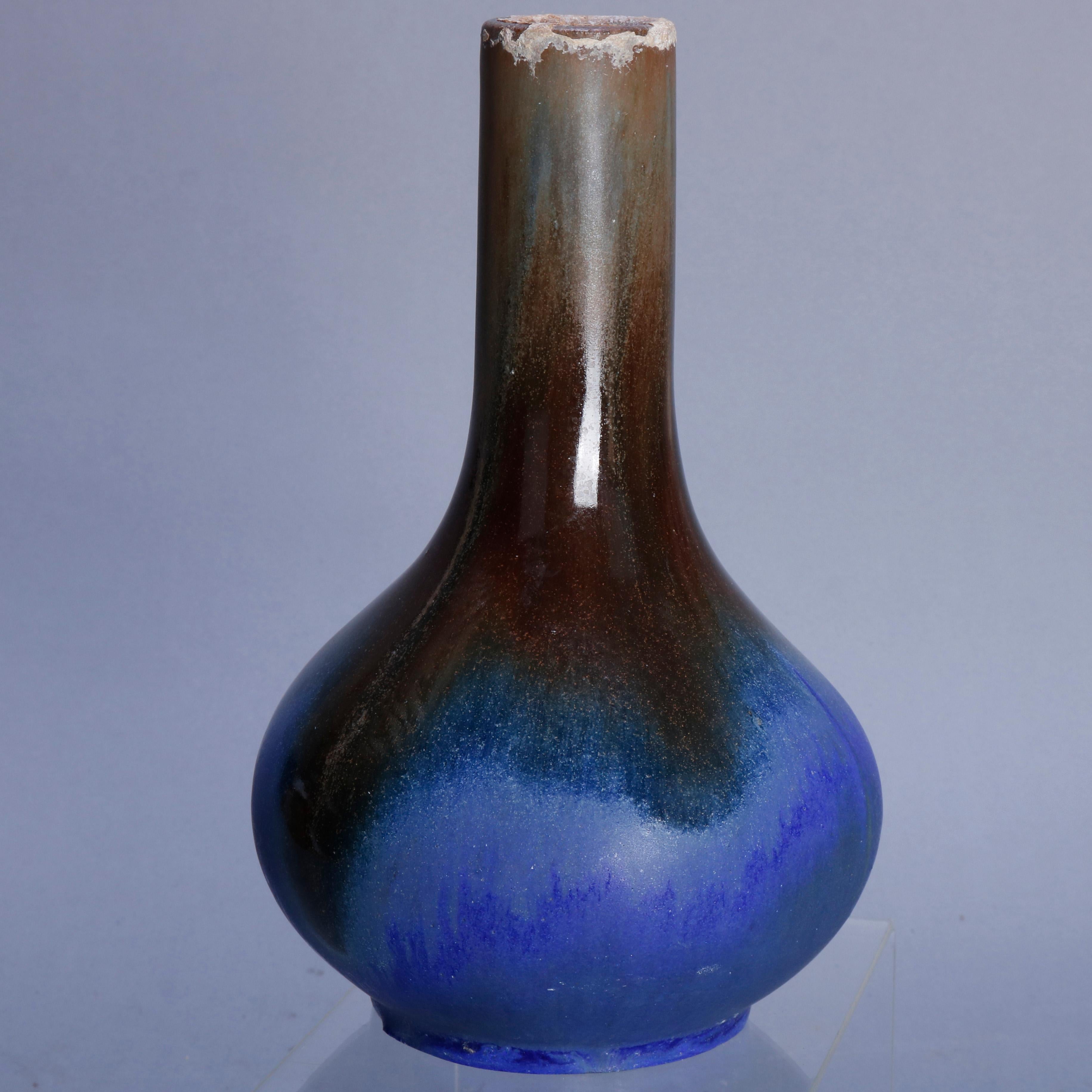 An antique Arts & Crafts art pottery bottle vase by Fulper offers drip glazing, original label on base, circa 1920

***DELIVERY NOTICE – Due to COVID-19 we are employing NO-CONTACT PRACTICES in the transfer of purchased items.  Additionally, for