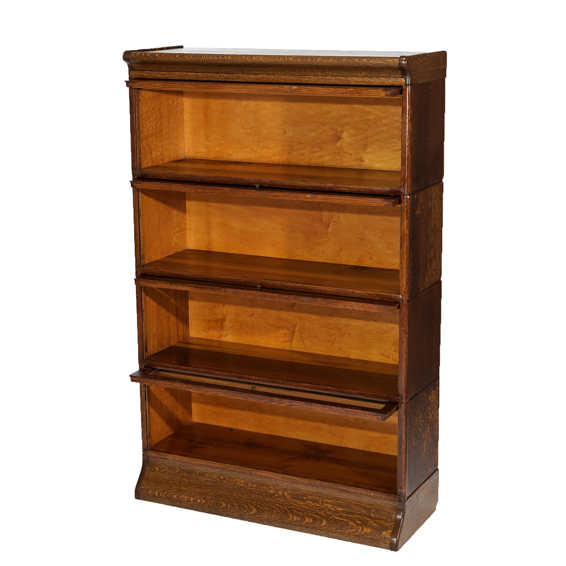 An antique Arts and Crafts barrister bookcase attributed to Macey offers quarter sawn oak construction with four stacks, each having pull out glass doors, raised on ogee base, c1910

Measures- 53.5'' H x 34'' W x 13.5'' D.

Catalogue Note: Ask about