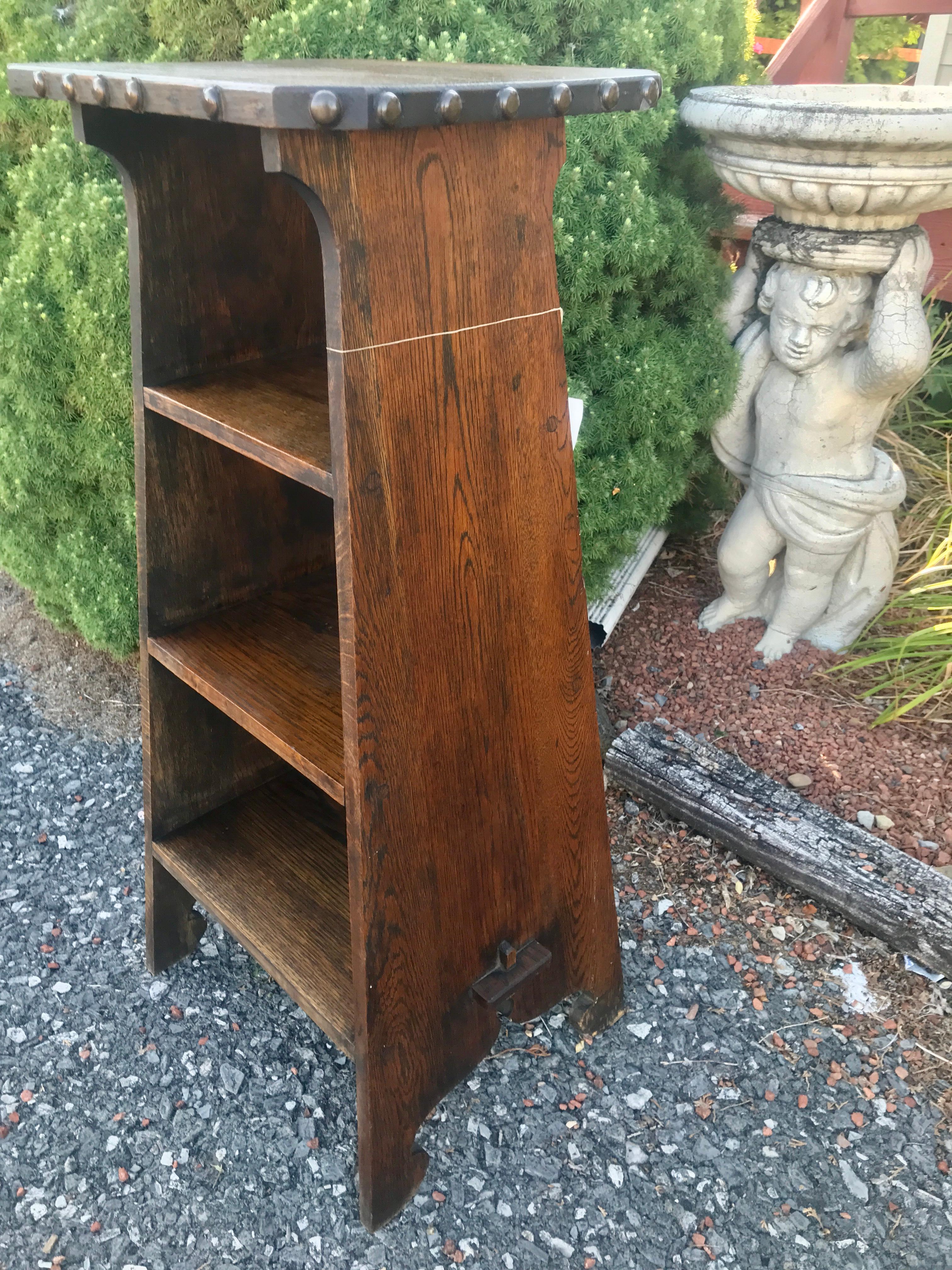 This is an antique Arts & Crafts Bookcase/Magazine Stand Marked 