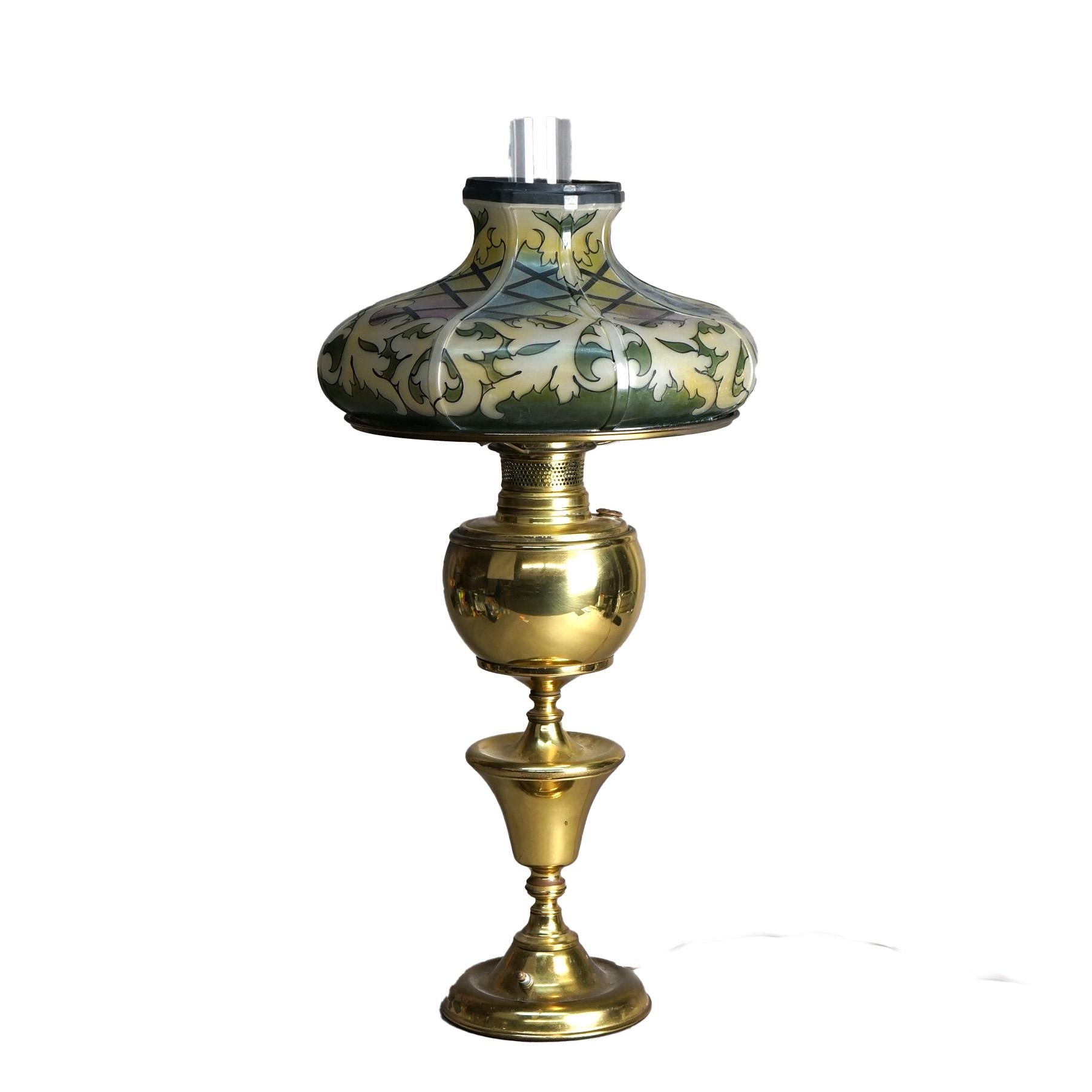 An antique Arts and Crafts banquet table lamp offers faceted glass shade with stylized leaded glass design over brass balustrade form base, c1910

Measures - 28 1/2