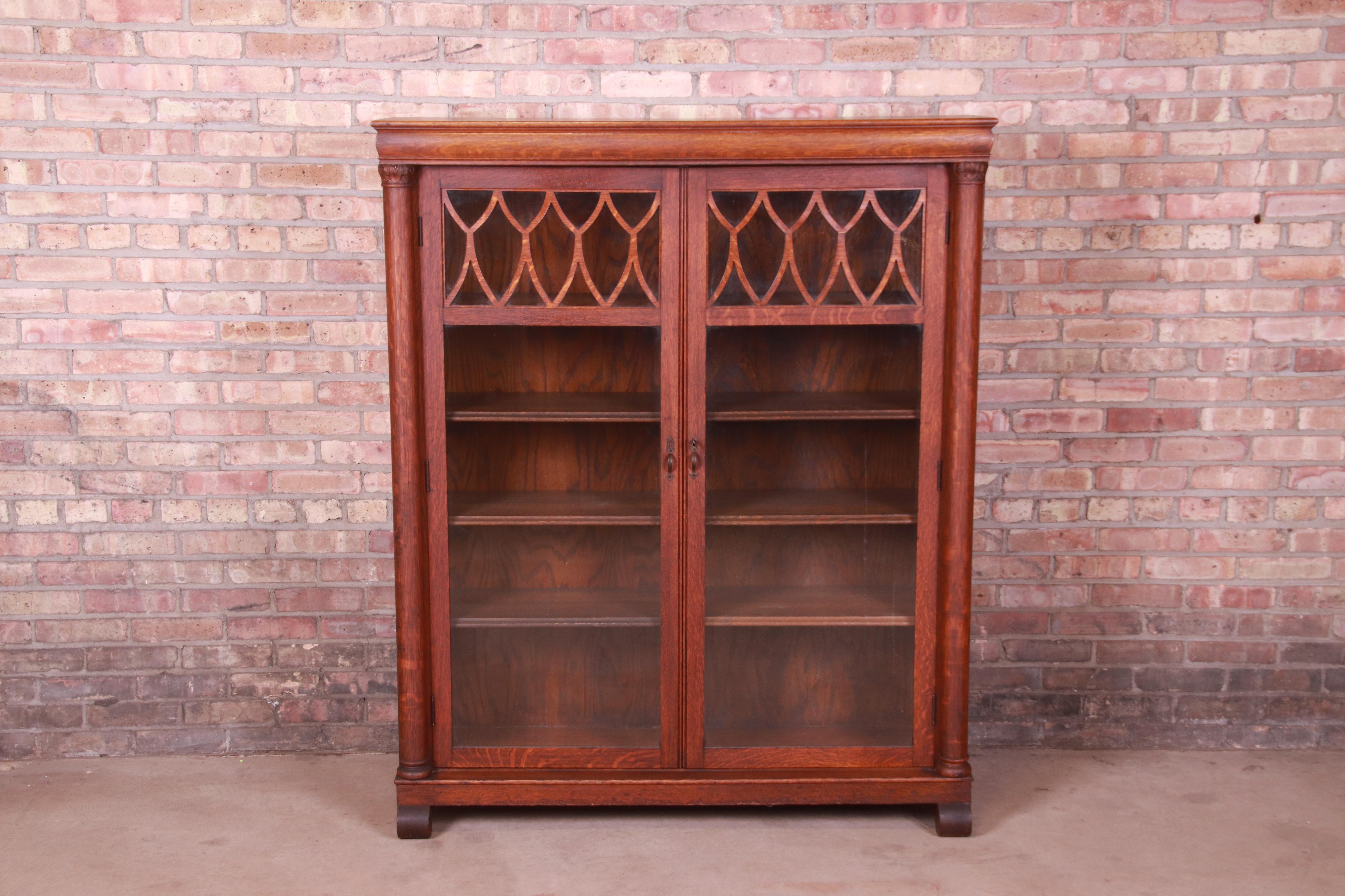 A beautiful antique Arts & Crafts double bookcase

USA, Circa 1900

Carved quarter sawn oak, with glass front doors. Cabinet locks, and key is included.

Measures: 48.25
