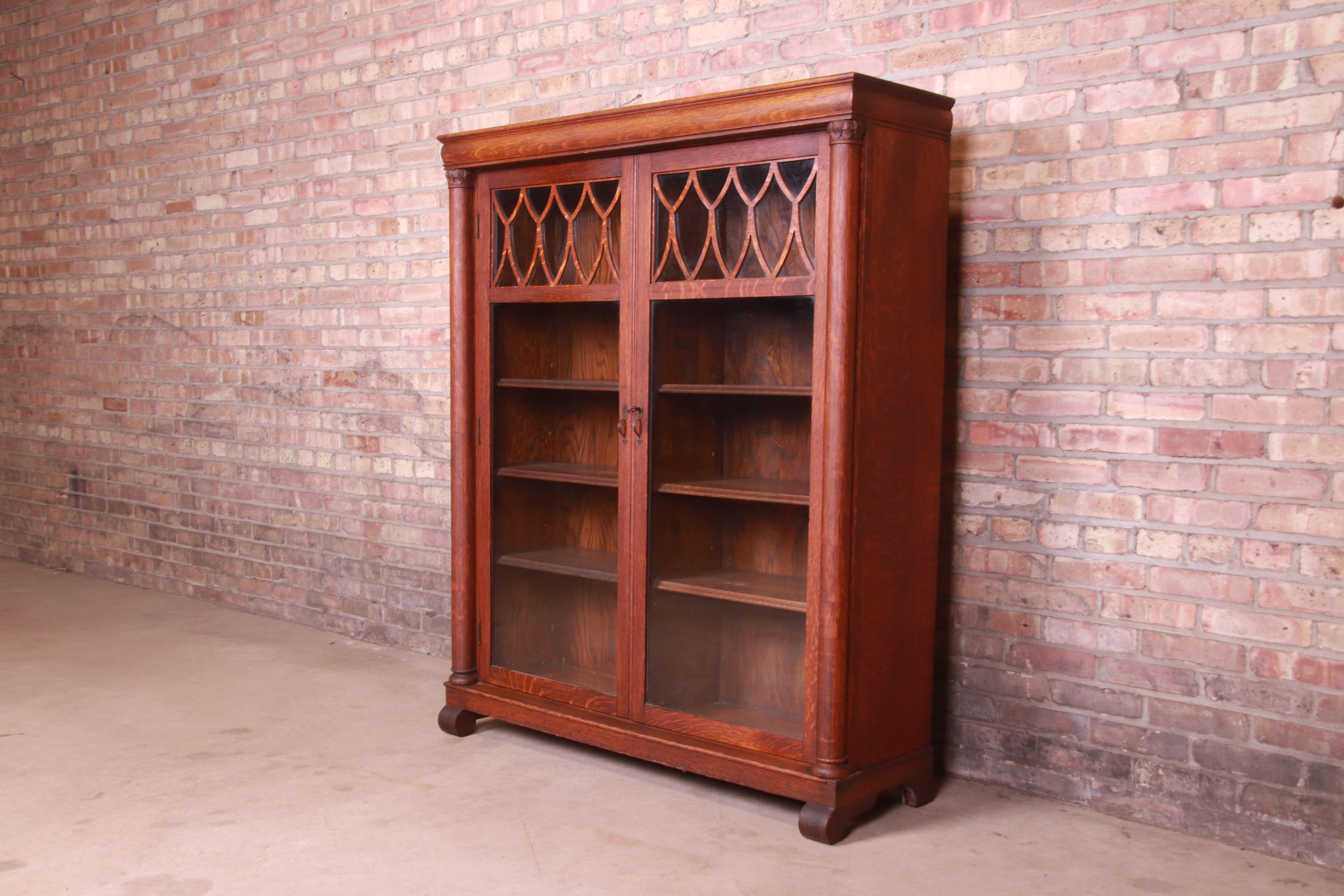 Antique Arts & Crafts Carved Oak Glass Front Double Bookcase, Circa 1900 In Good Condition In South Bend, IN