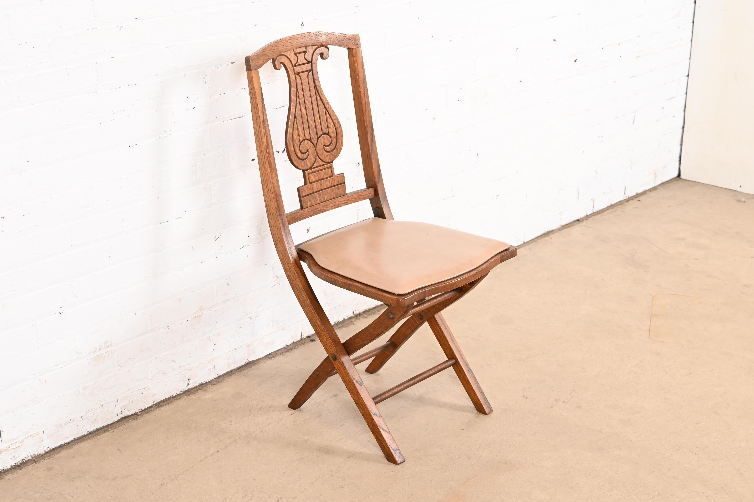 Arts and Crafts Antique Arts & Crafts Carved Oak Lyre Back Folding Chair by Phoenix Chair Co. For Sale