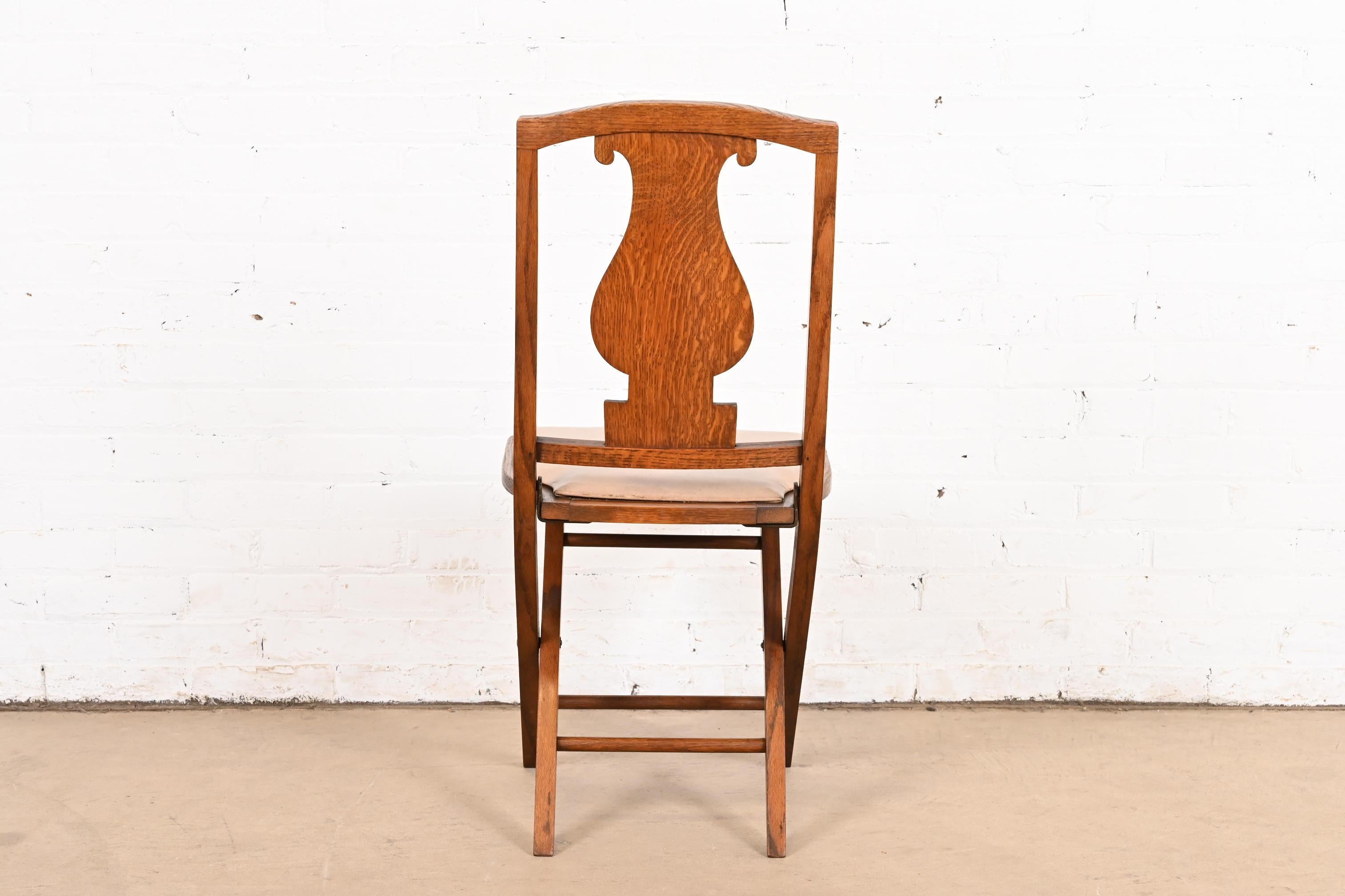 Antique Arts & Crafts Carved Oak Lyre Back Folding Chair by Phoenix Chair Co. For Sale 3