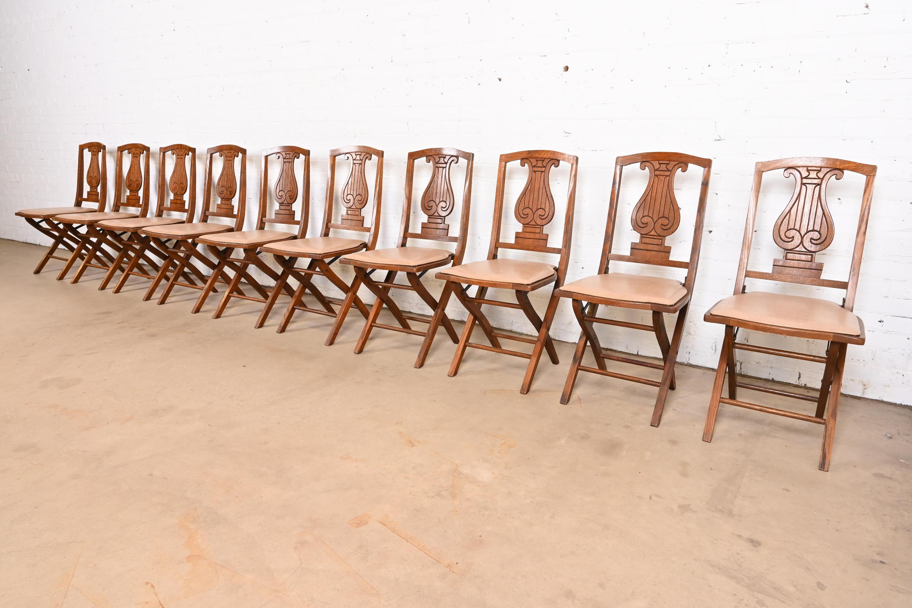 A rare and exceptional set of ten Arts & Crafts period lyre back folding dining chairs or side chairs

By Phoenix Chair Company

USA, Circa 1920s

Carved oak, with tan vinyl upholstery.

Measures: 16.75