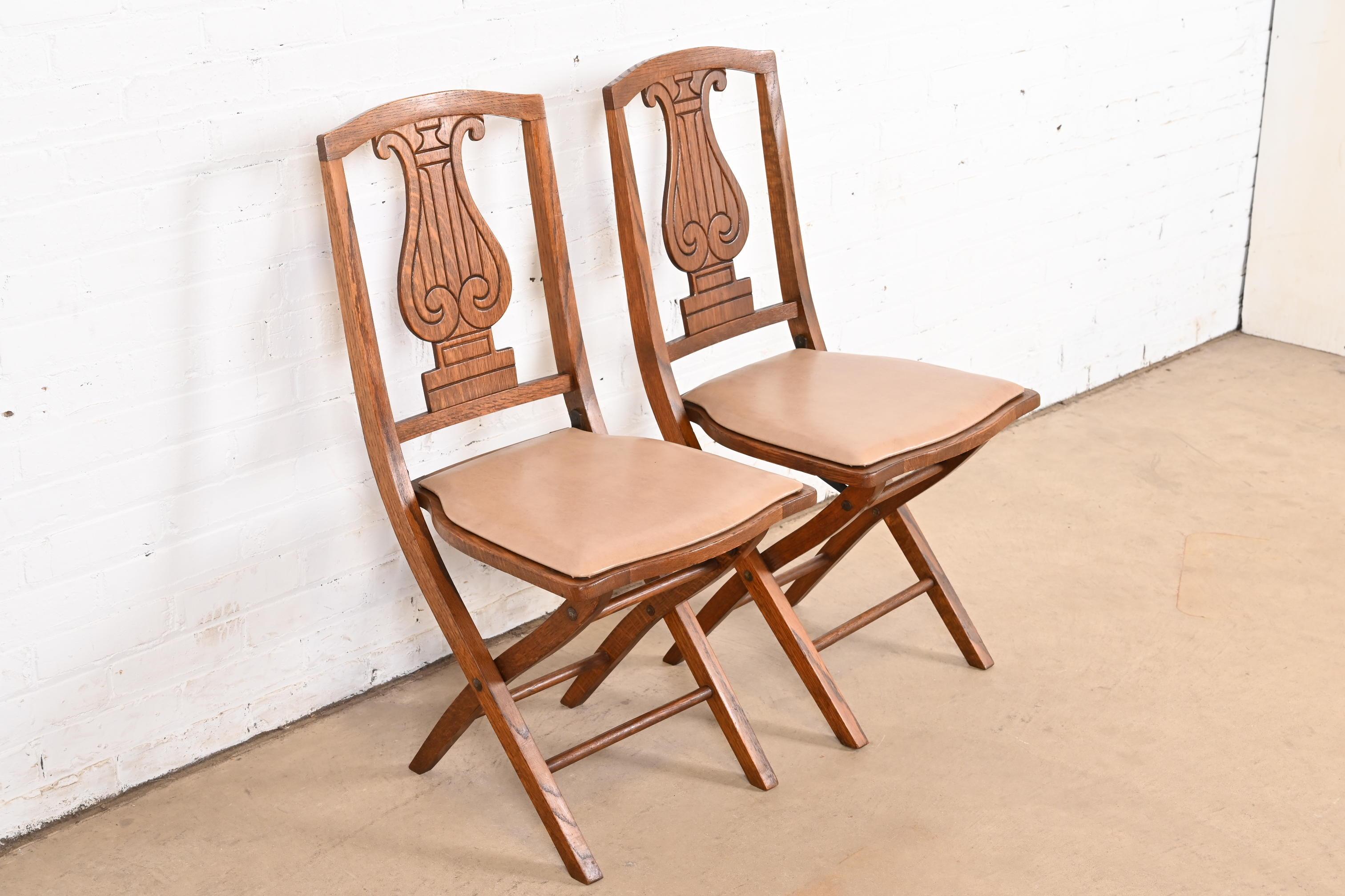 Arts and Crafts Antique Arts & Crafts Carved Oak Lyre Back Folding Chairs by Phoenix Chair Co. For Sale