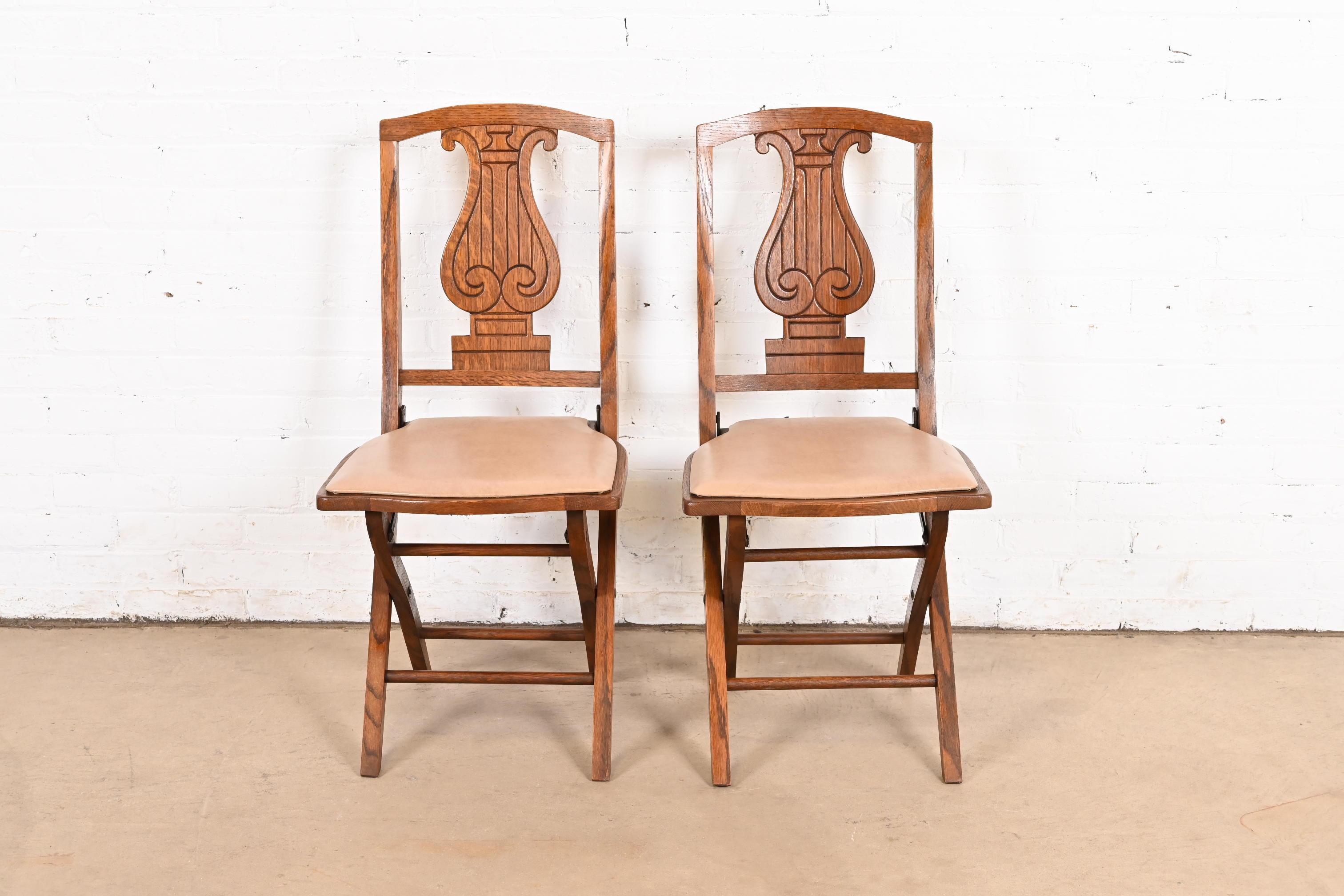 Antique Arts & Crafts Carved Oak Lyre Back Folding Chairs by Phoenix Chair Co. In Good Condition For Sale In South Bend, IN