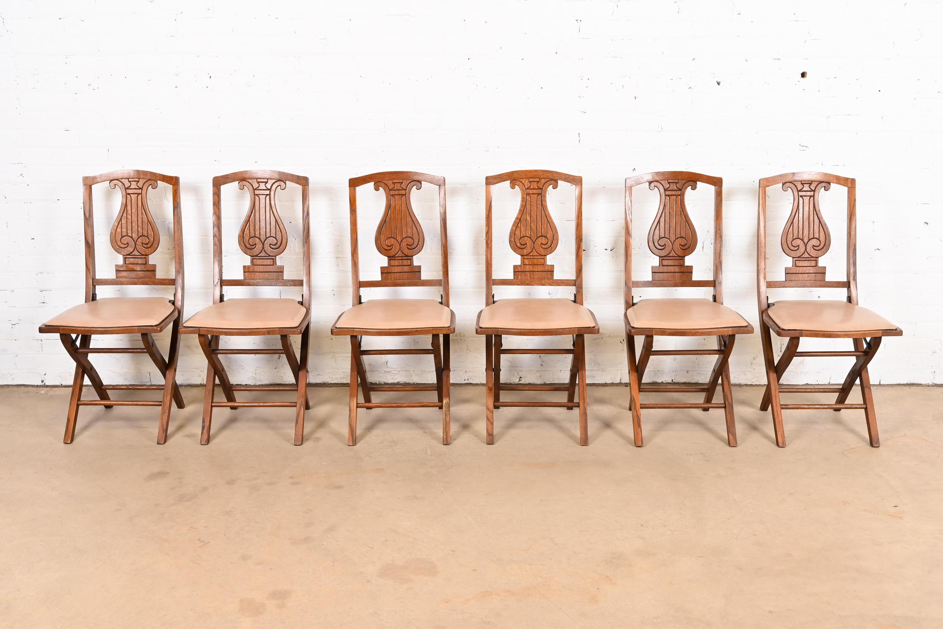 Antique Arts & Crafts Carved Oak Lyre Back Folding Chairs by Phoenix Chair Co. In Good Condition For Sale In South Bend, IN