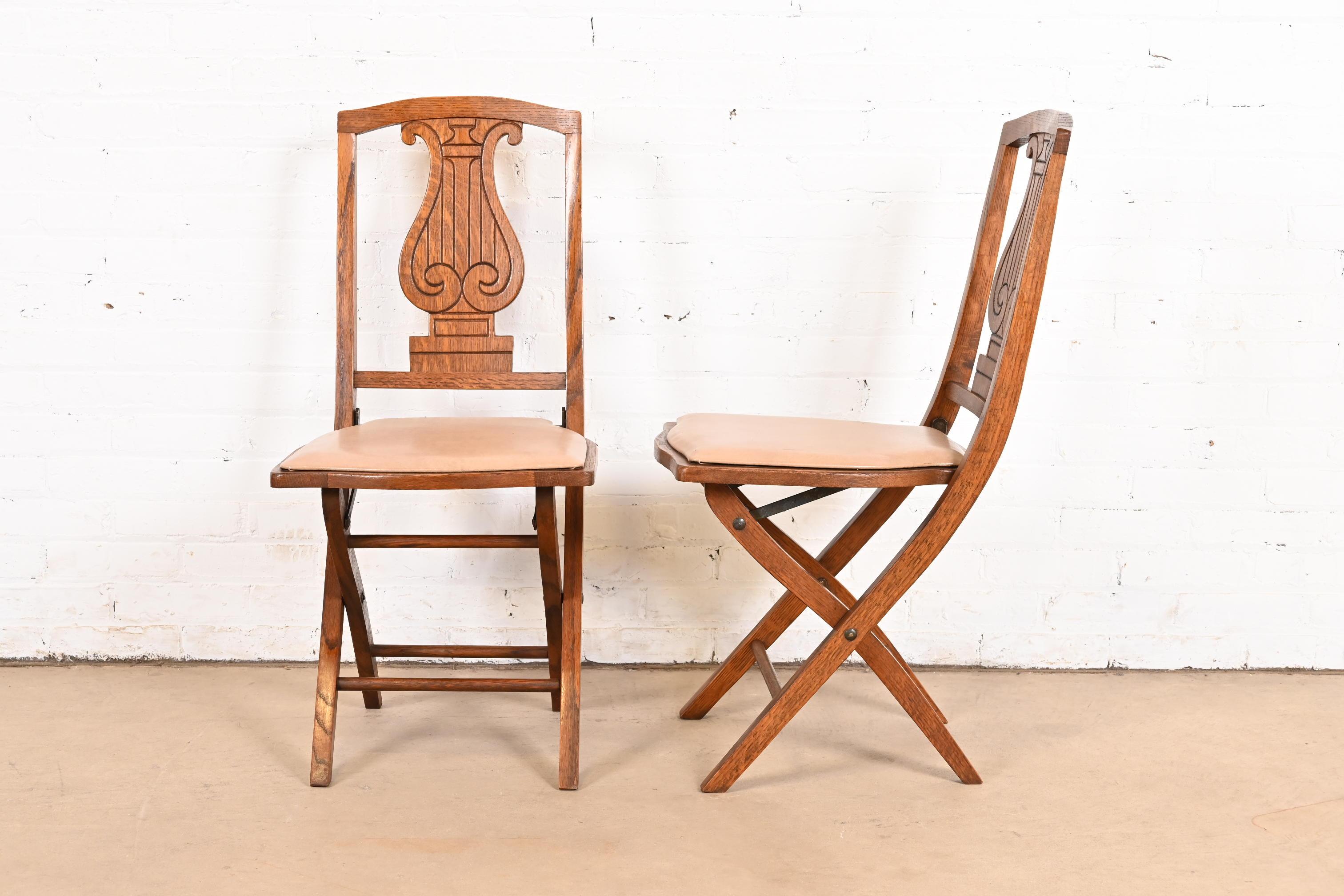 Antique Arts & Crafts Carved Oak Lyre Back Folding Chairs by Phoenix Chair Co. For Sale 2