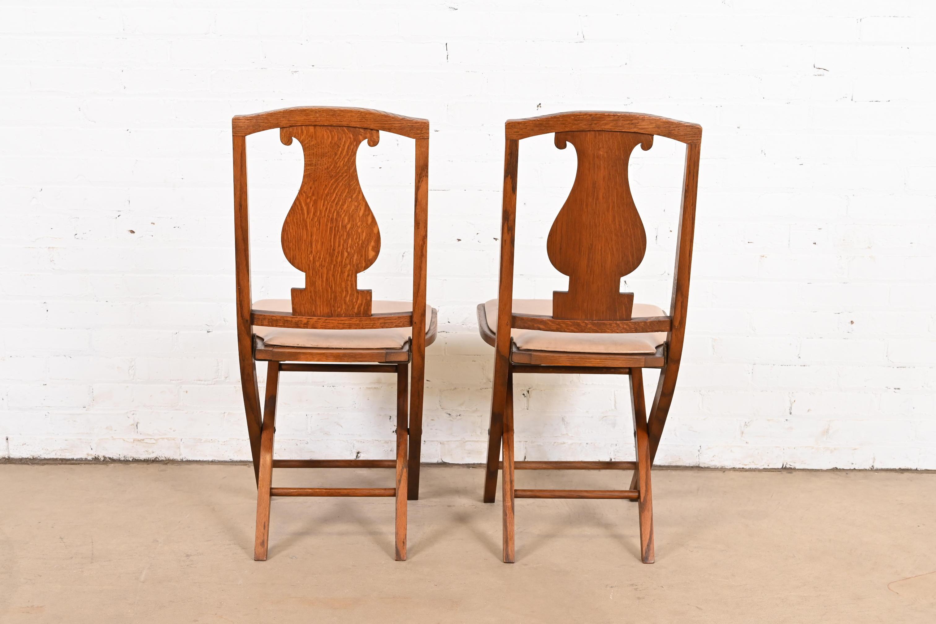Antique Arts & Crafts Carved Oak Lyre Back Folding Chairs by Phoenix Chair Co. For Sale 3