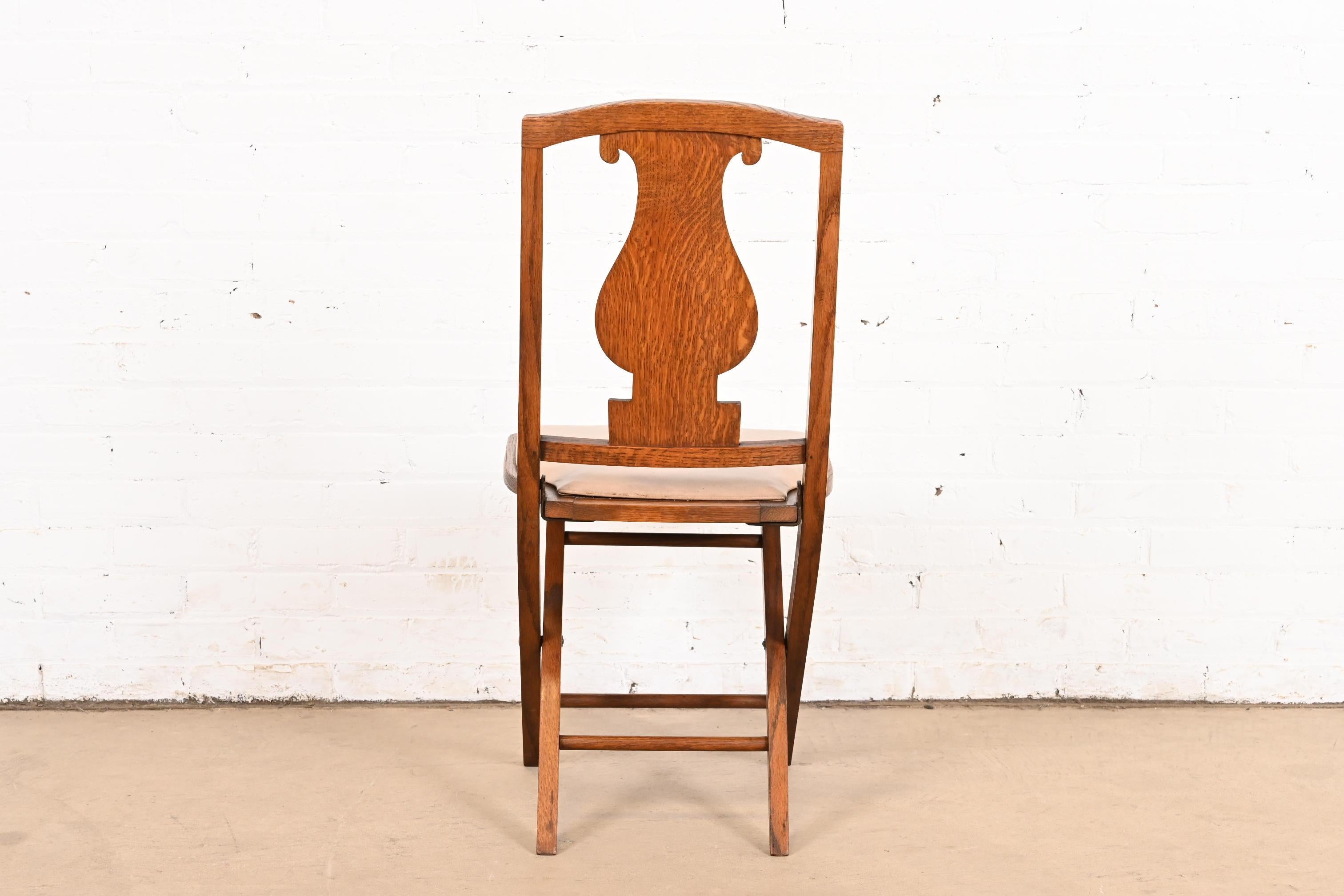 Antique Arts & Crafts Carved Oak Lyre Back Folding Chairs by Phoenix Chair Co. For Sale 3