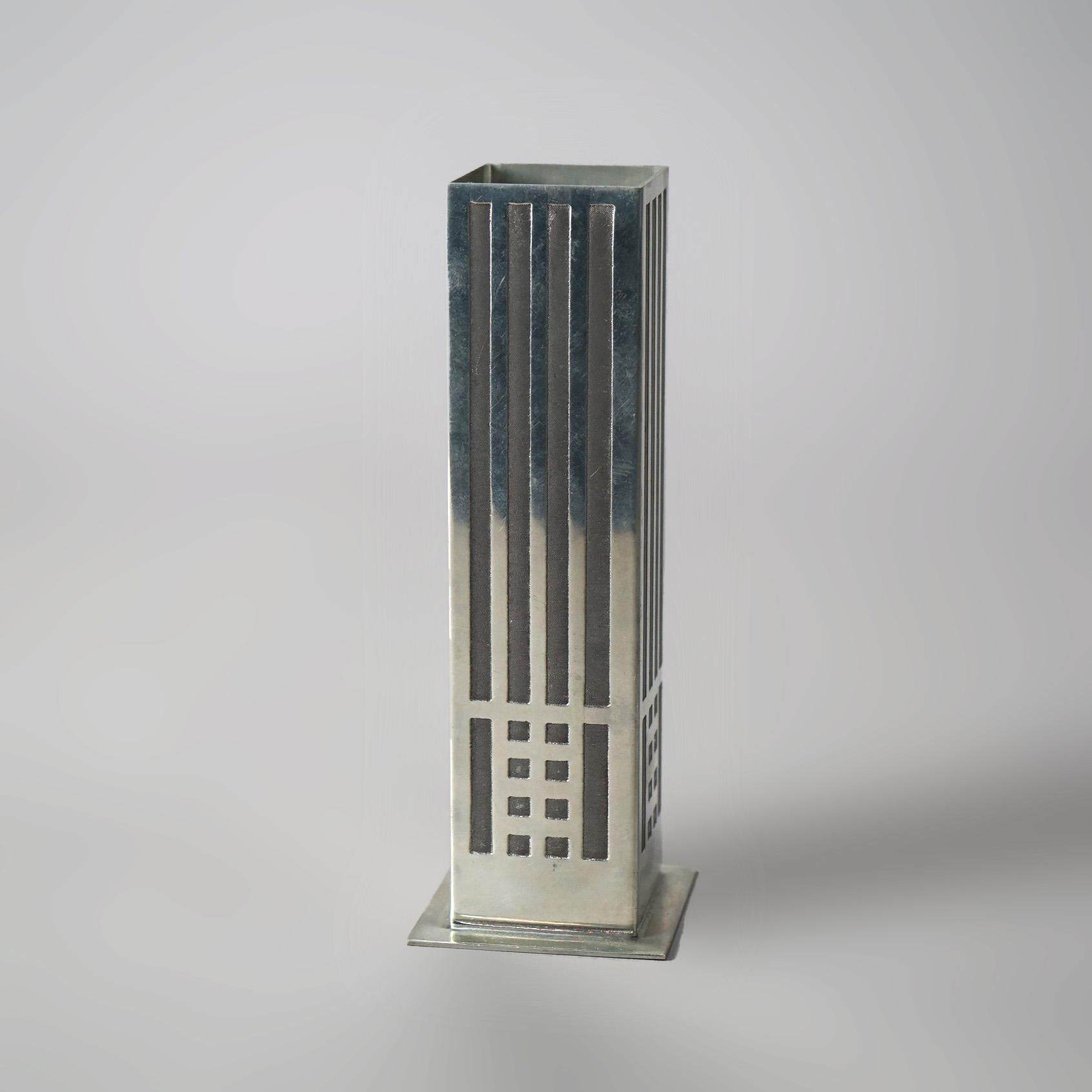 AN antique Arts and Crafts bud vase by Charles Rennie Mackintosh (1868 - 1928) offers polished pewter construction in geometric form, maker stamp on base as photographed, c1920

Measures - 6.25